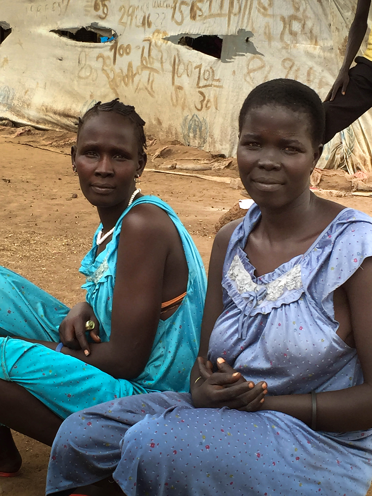 Refugee women wait to be moved out of a transit center near Pagak, Ethiopia.
