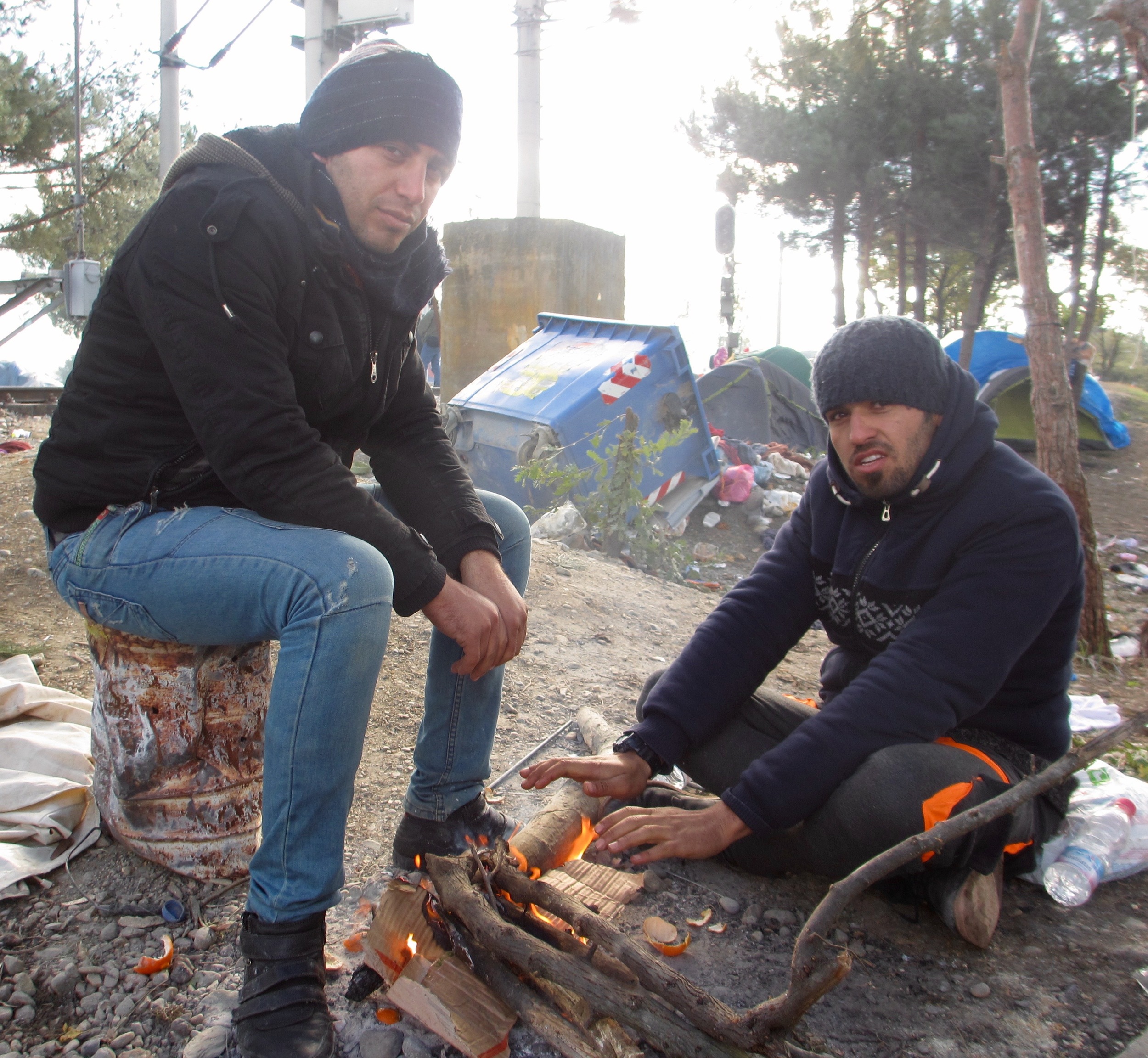 Two Iranian men make a fire at Idomeni transit camp on Greece’s northern border with Macedonia.