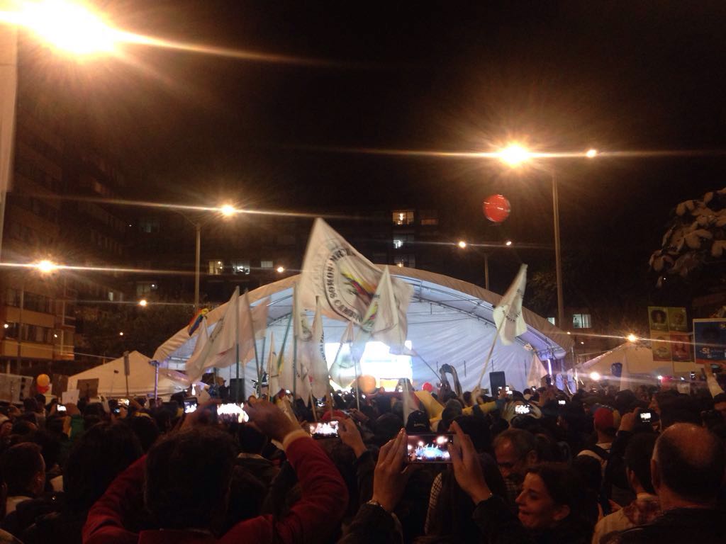 Celebrations in a Bogotá plaza on August 24, 2016, the evening that FARC guerillas and the Colombian government came to a final agreement. The announcement was broadcast live from Havana, Cuba.