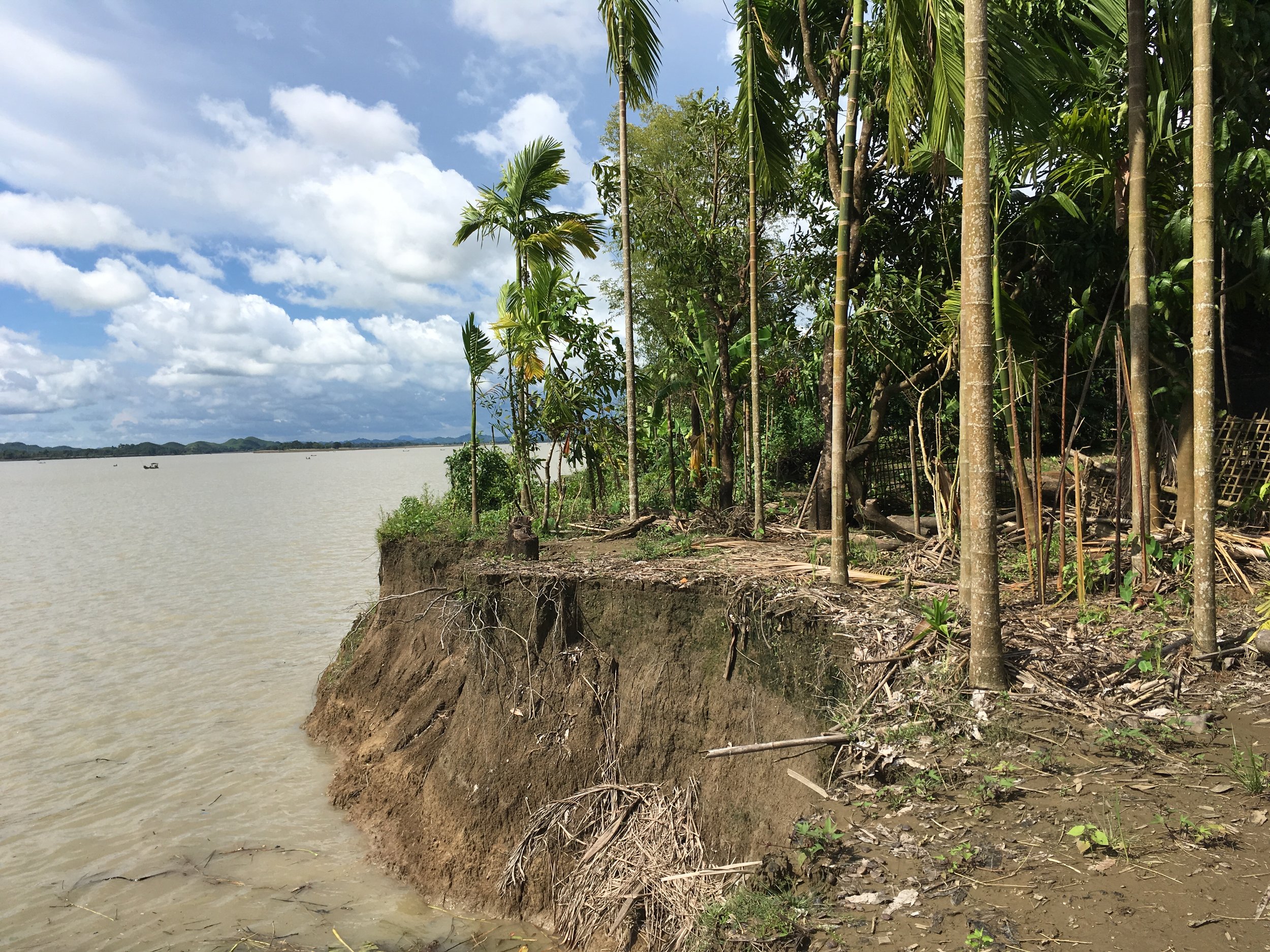 Before the 2015 floods and landslides, villagers living on the river bank in Hla Ta village in Mimbya, Rakhine State, used to grow crops and tend to a scattering of animals around their basic bamboo huts. The 2015 floods and landslides caused a 40-foot strip of land along the river bank to fall into the water, taking with it shelters, animals, and crops. Many villagers have now had to take out loans to feed their families. In the context where poor, rural villagers in Myanmar are often already heavily indebted, this is particularly concerning.