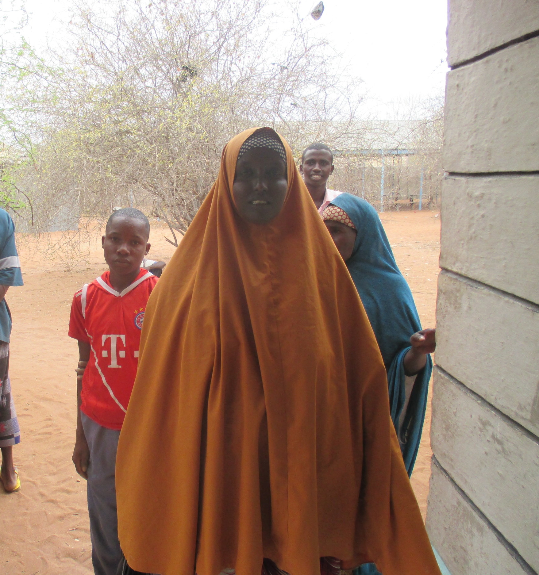 A Somali refugee waits outside a Returns Help Desk in Dadaab, Kenya. She said she is registering for return to Somalia out of fear of what the Kenyan government might do if she does not.
