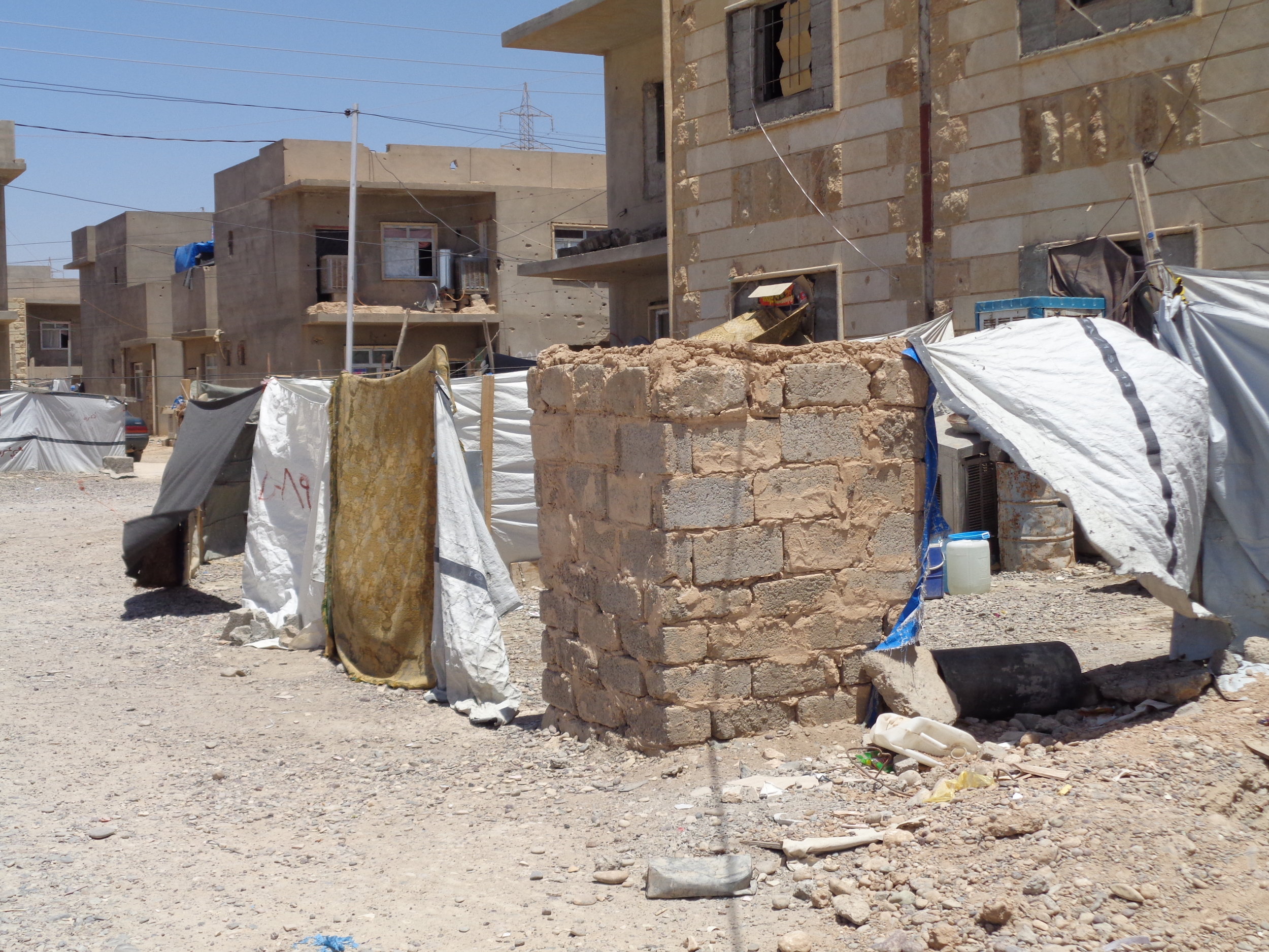 The camp is a series of unfinished buildings that turned into an IDP site over the past several years as people fled ISIS.