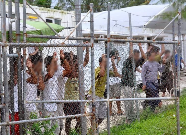 Credit: Reuters. Asylum-seekers at Manus Island detention center, Papua New Guinea, 2014.