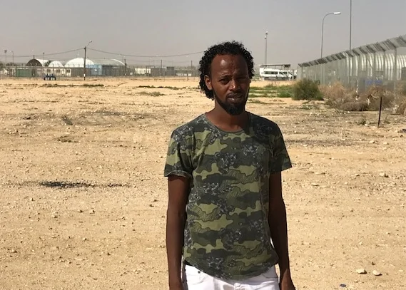 Asylum seeker outside of the Holot Detention Center