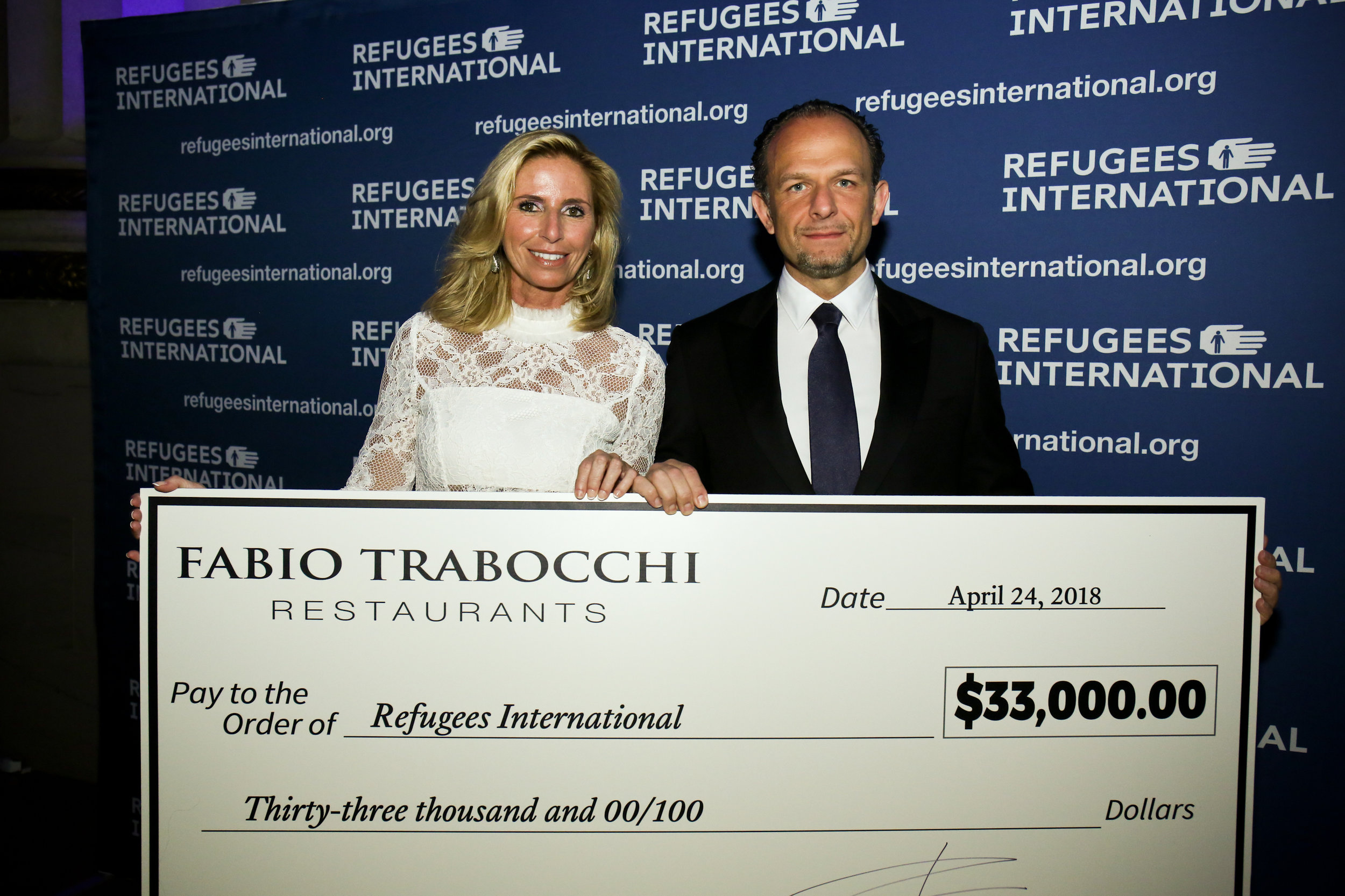 Maria and Fabio Trabocchi present their generous gift to Refugees International