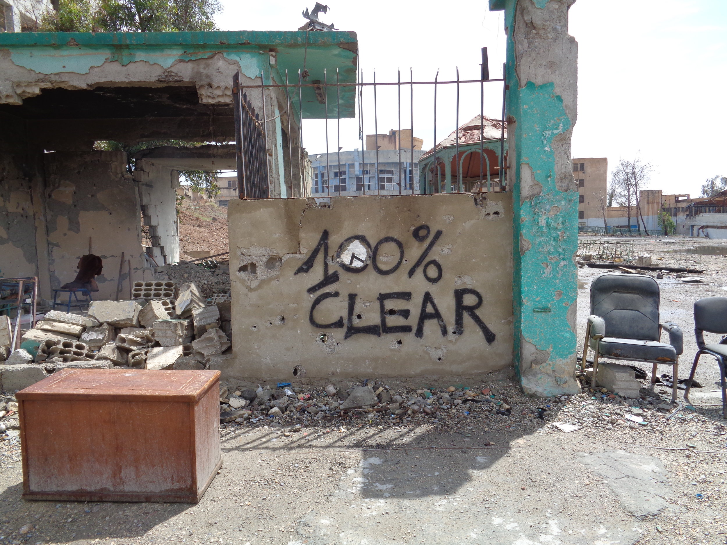 Sign noting one building in Raqqa city cleared of explosive devices.