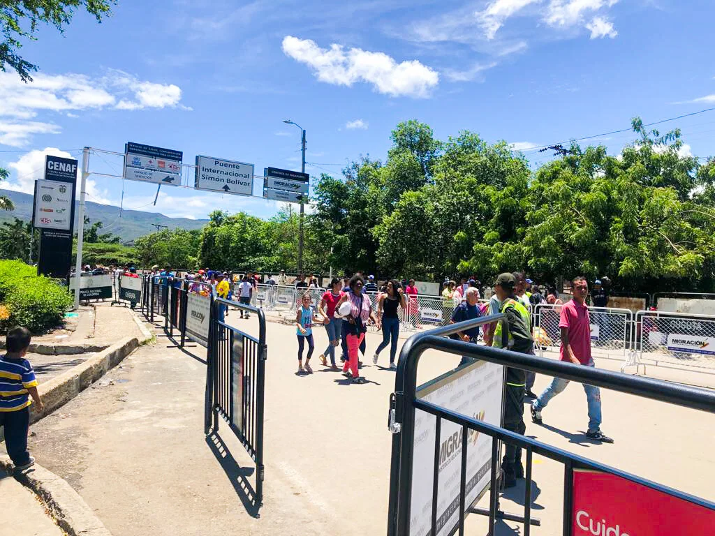 The Simón Bolívar International Bridge is the primary crossing point between Venezuela and Colombia’s northeastern border just outside Cúcuta. Signs point to the Assistance and Orientation Point where international organizations provide emergency services, and to government passport control. Photo Credit: Refugees International.