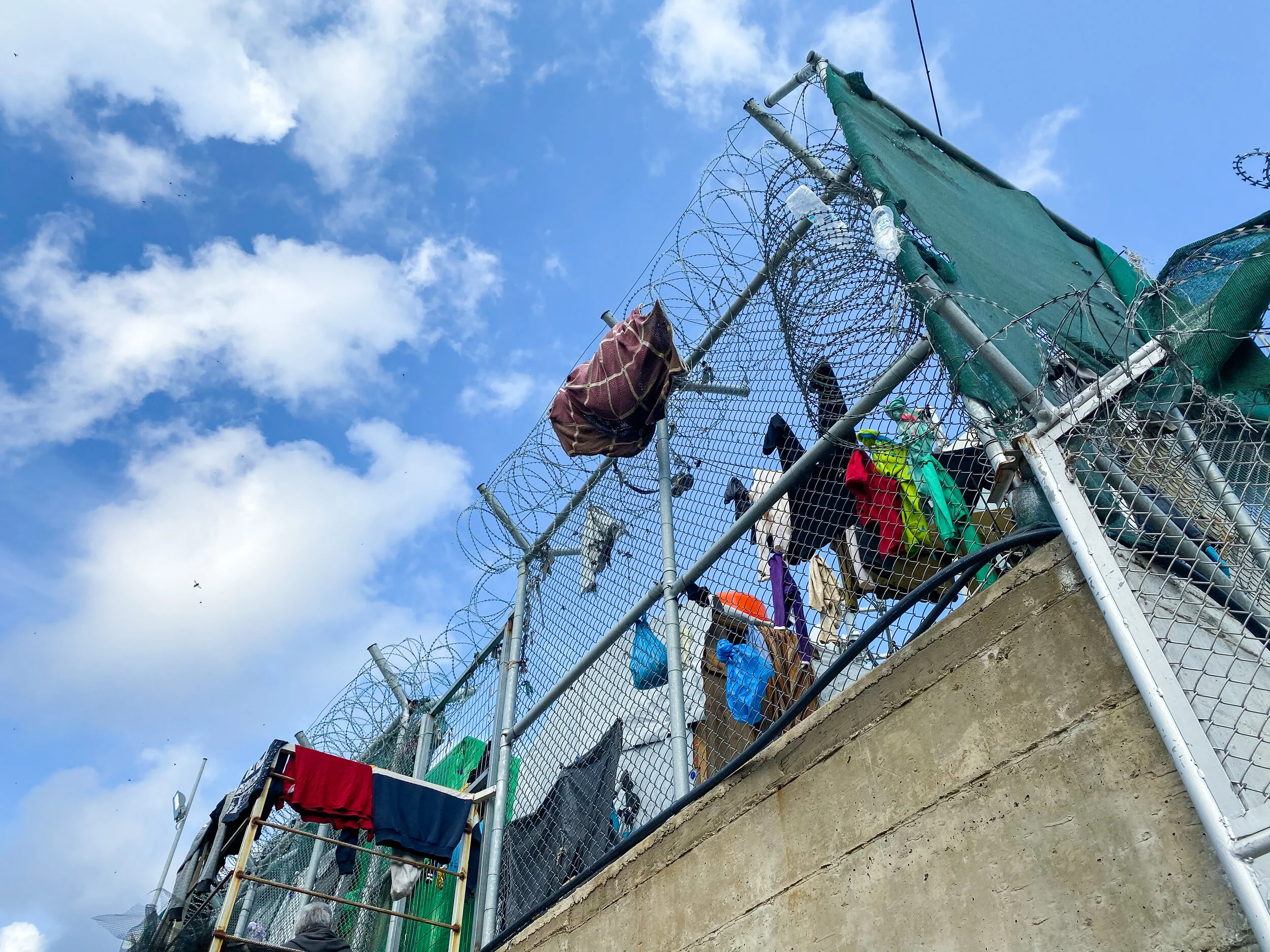 Outer gates of Moria Reception and Identification Center. Photo by: Devon Cone.