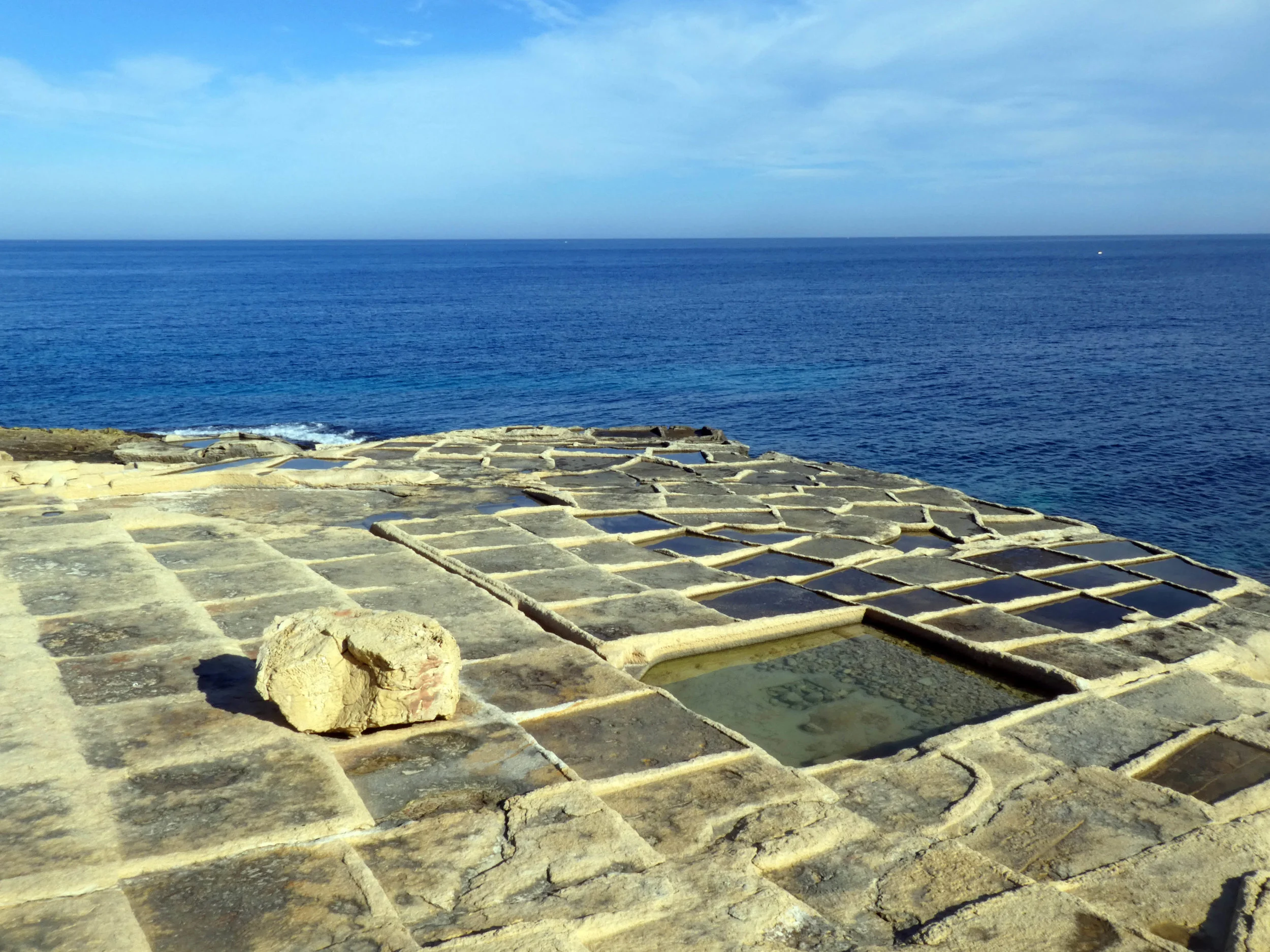 Sea salt is in Malta harvested in traditional salt pans which are carved into the limestone rock. Even I get my salt there and grind it in a Peugeot mill for use in the kitchen.
