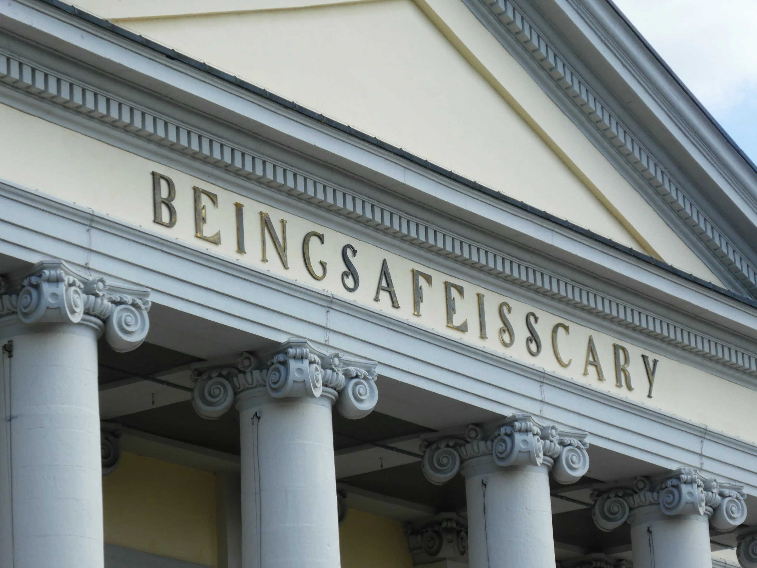 The Kassel Fridericianum crowned by the letters BEINGSAFEISSCARY