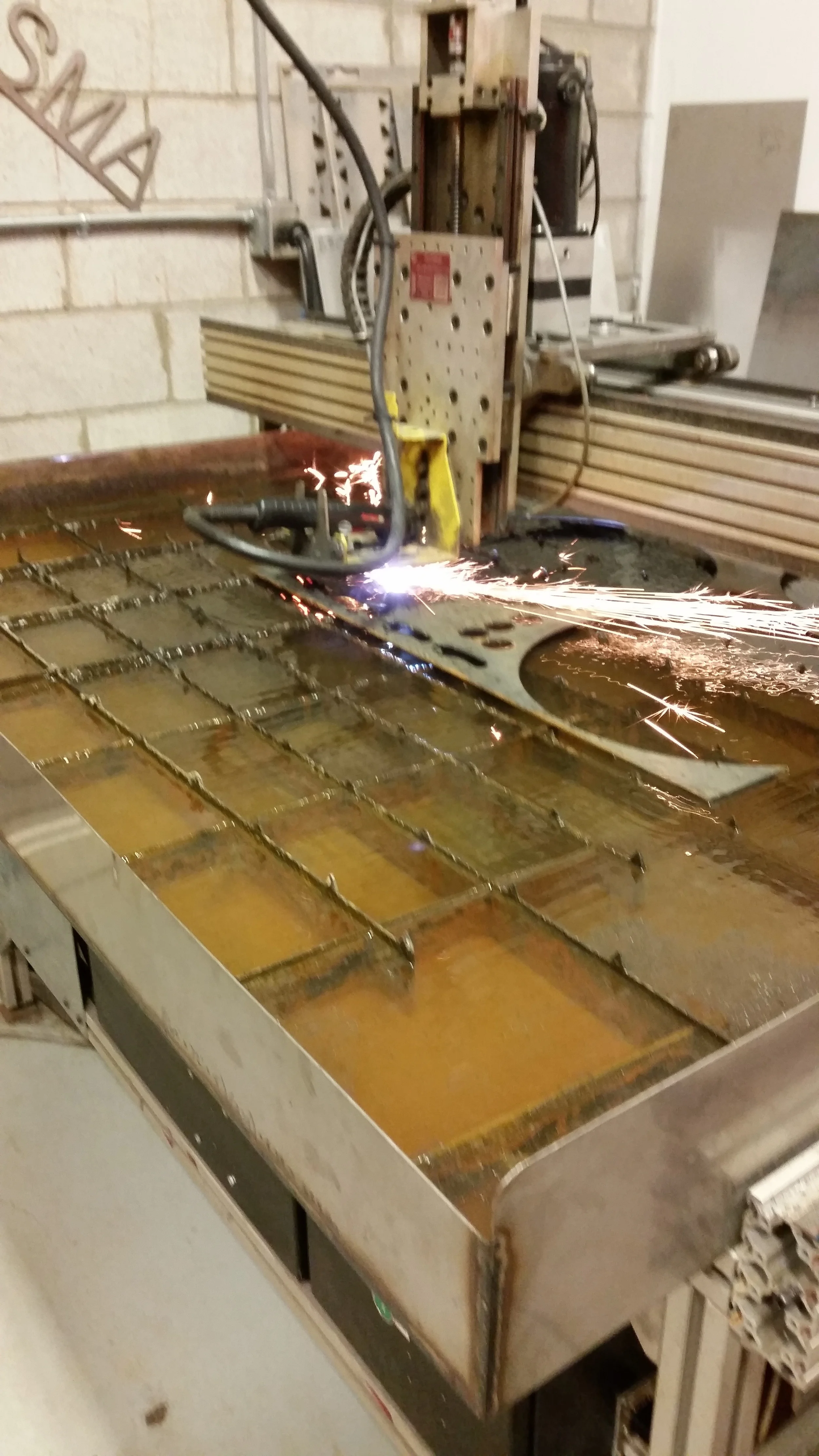 Plasma cutter cutting steel, computer driven