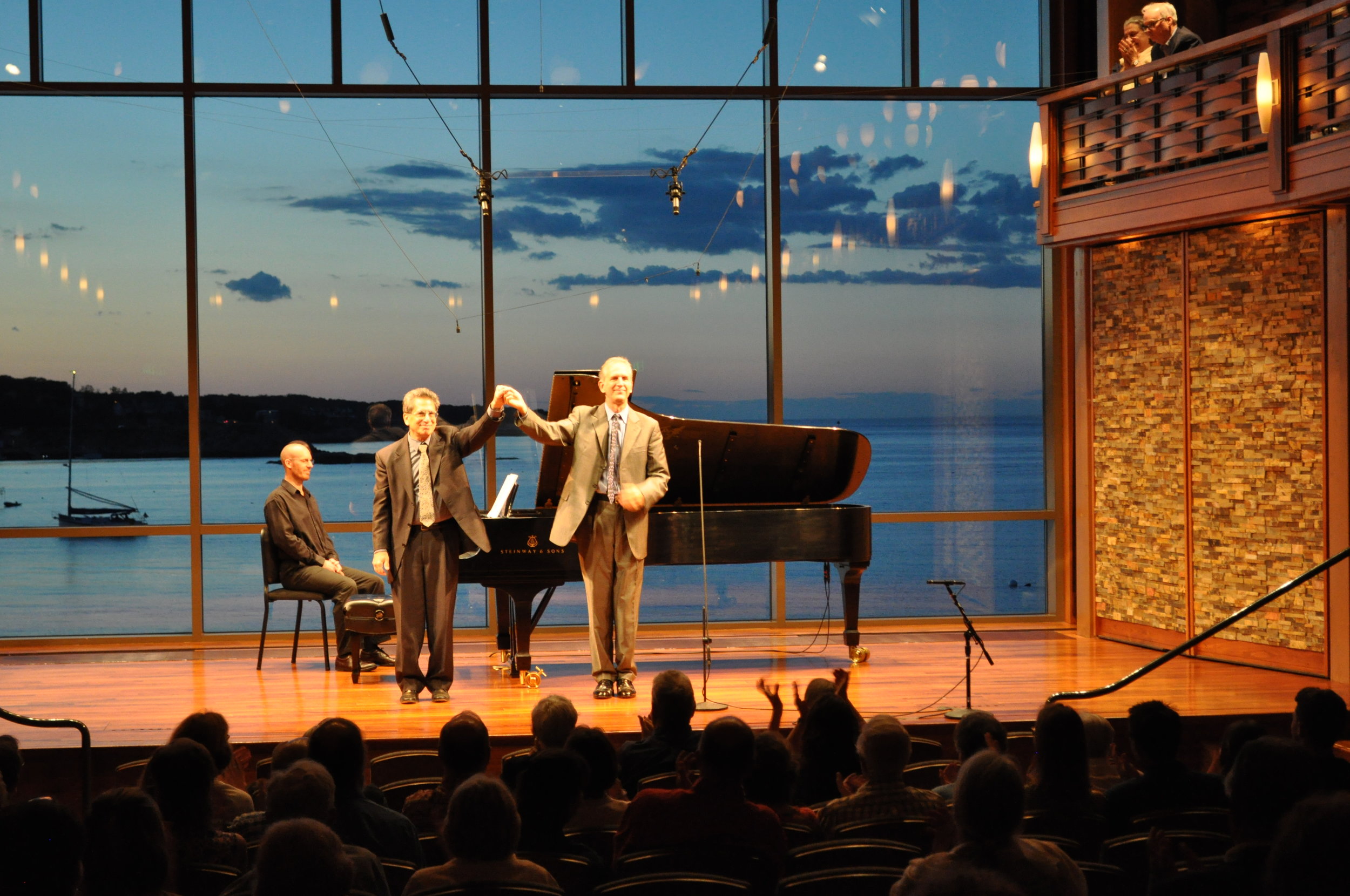 Composer and pianist David Alpher (left) takes a bow with baritone Robert Osborne after the premiere of "Between Twilights," settings of poems by Marsden Hartley, Saturday evening at the Rockport Chamber Music Festival. Karen Herlitz photograph.