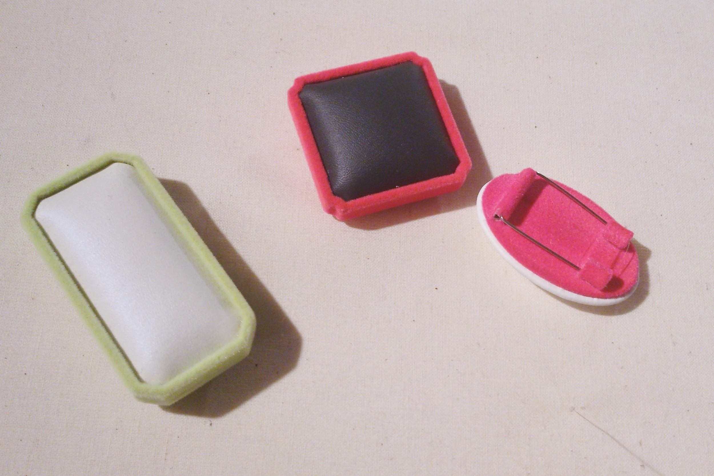 A trio of Cheung's brooches