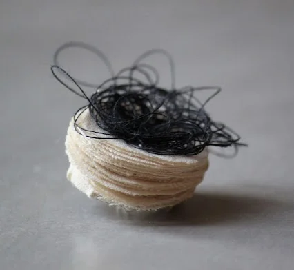 Hazel Terry's button uses found thread
