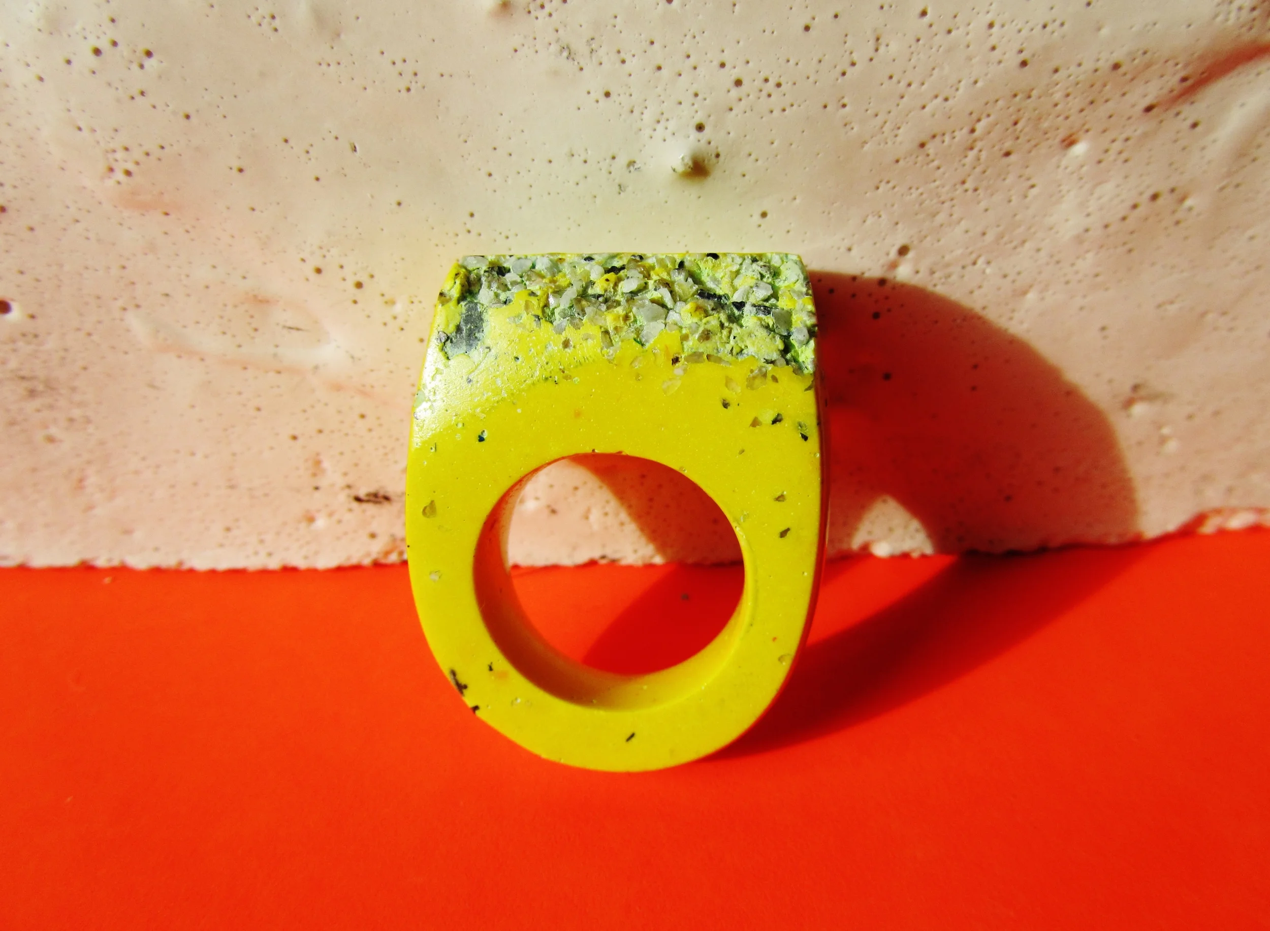 For this bright yellow ring I've used granite for a rugged edge.