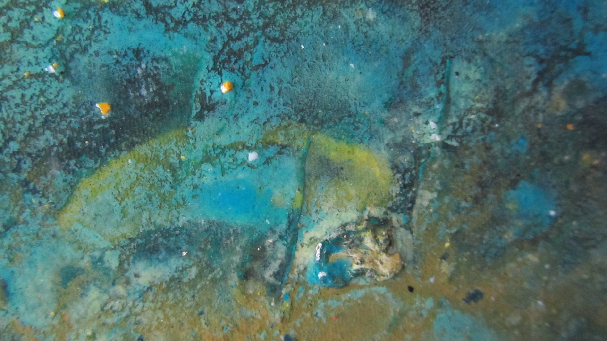  Hand shaping my pieces has left patterns of residue on the textured emery paper.