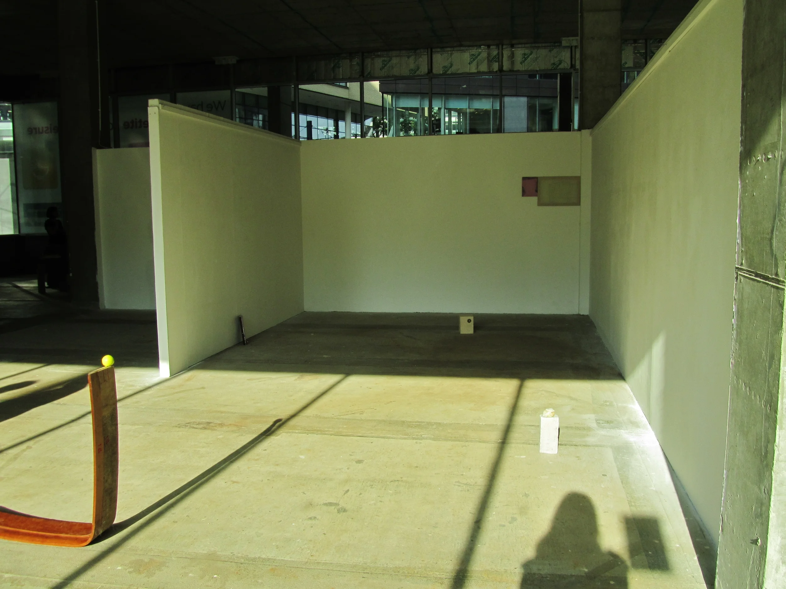 Left to right, a part of Jo McGonigal's Painting II , Lisa Denyer Temple 2014 Acrylic and emulsion on re configured cupboard door, Willow Rowlands Dog Fruit 2014 Plywood and vacuum plastic, Sarah McNulty Paint II 2014, Guache, fabric, paper. Lisa Denyer Untitled 2014 Found brick & Omani stone, 