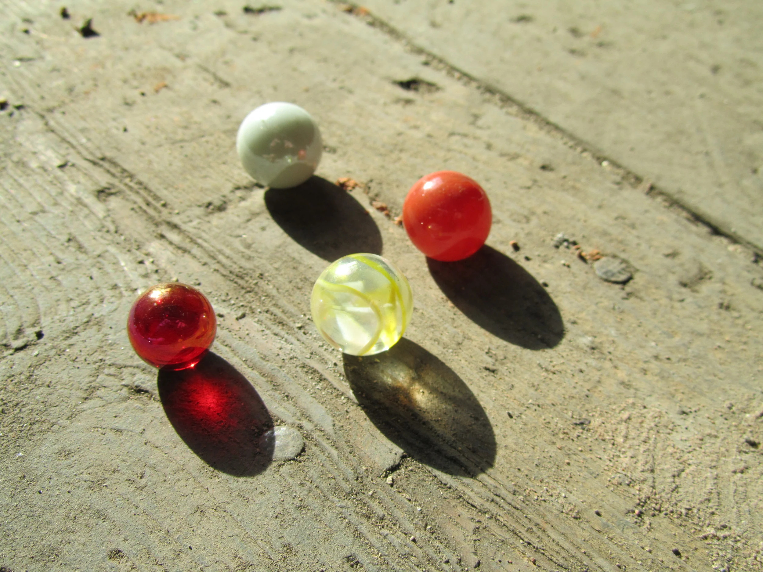 Playing marbles. The milky white one above was used in the Sweet Ruin Ring!