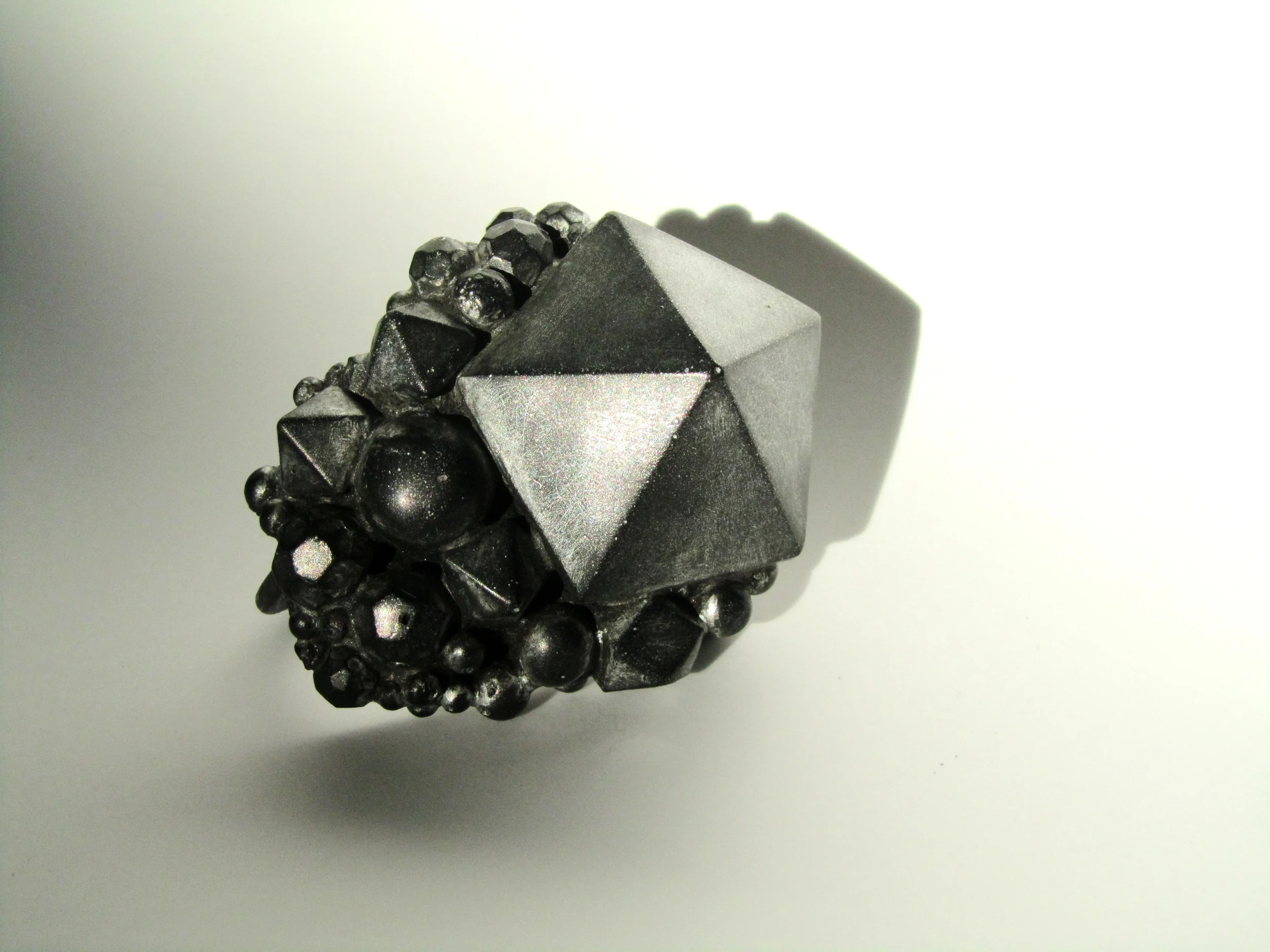 Nebula Ring 2011, As featured on Vogue China Oxidised silver, resin and metal dust by jewellery artist Jade Mellor.