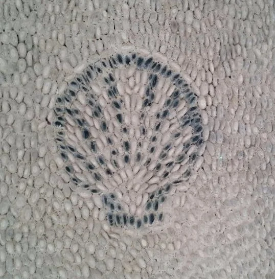 Shell mosaic made from pebbles in the floor of the spar