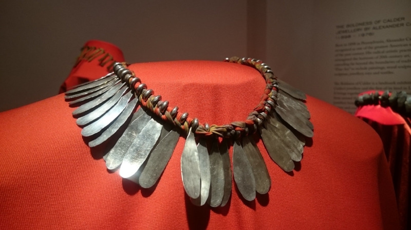 Calder necklace combining textiles and metal