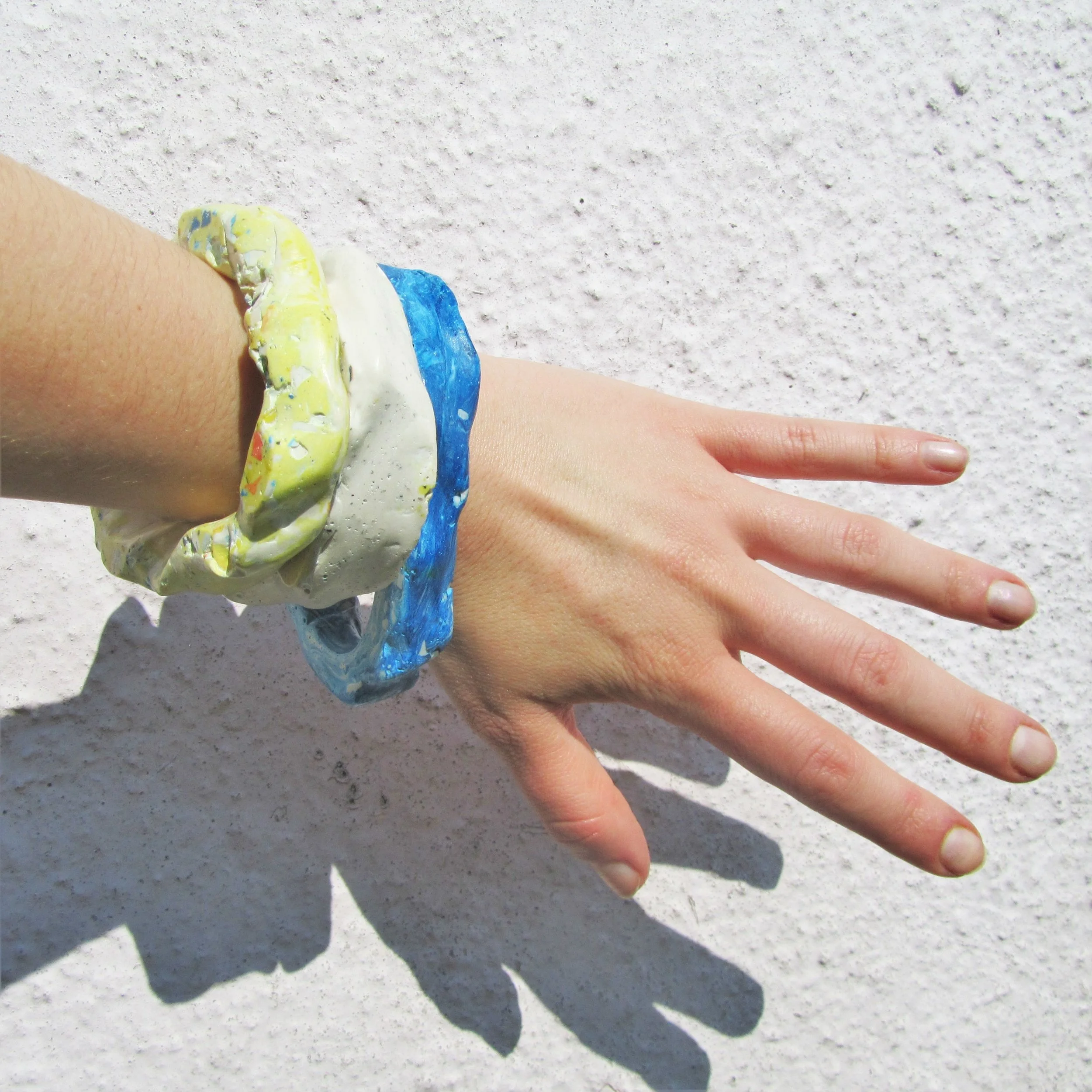 jade mellor rock cycle bangles recycled resin worn stack.JPG