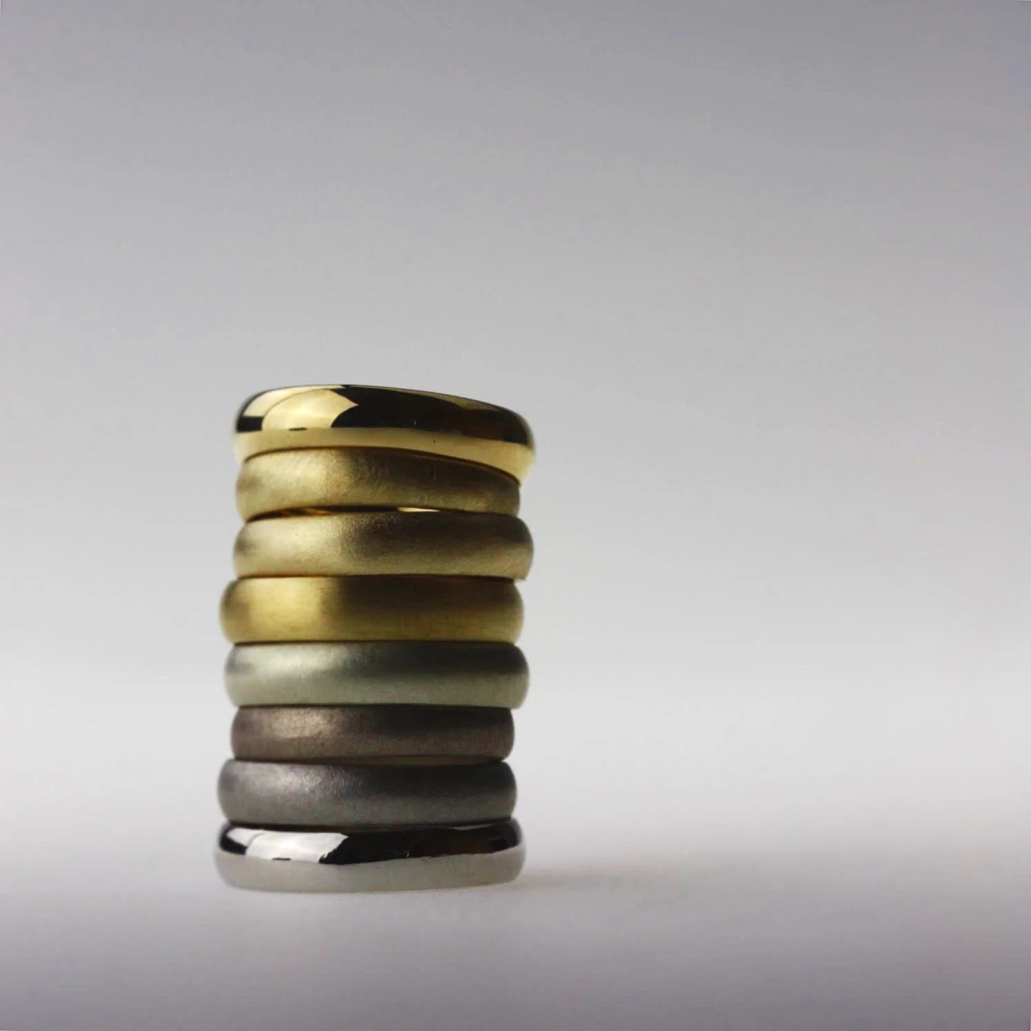 Stack of wedding bands in different precious metals by my superskilled jeweler friend Rachel Jones who specialised in metal alloys for her MA at the RCA.
