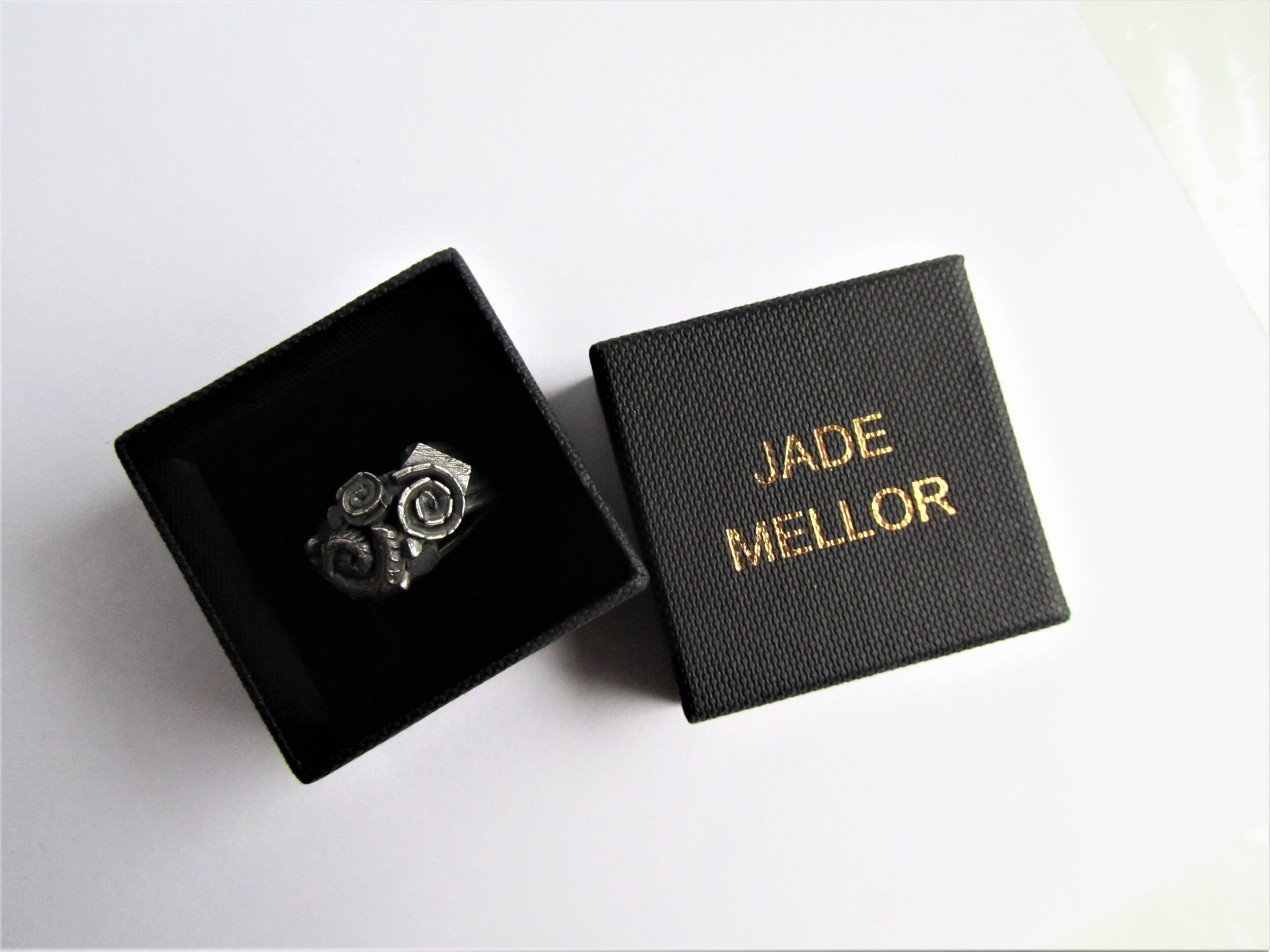 jade mellor caddis cluster ring small box.JPG