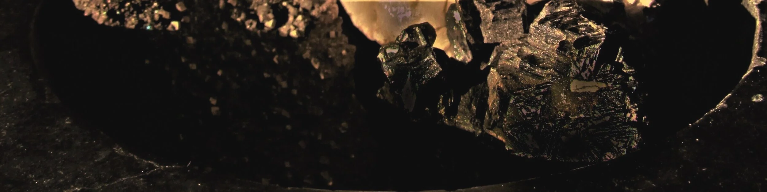 jade+mellor+logo+background+warm+bronze+pyrite+%282%29.jpg