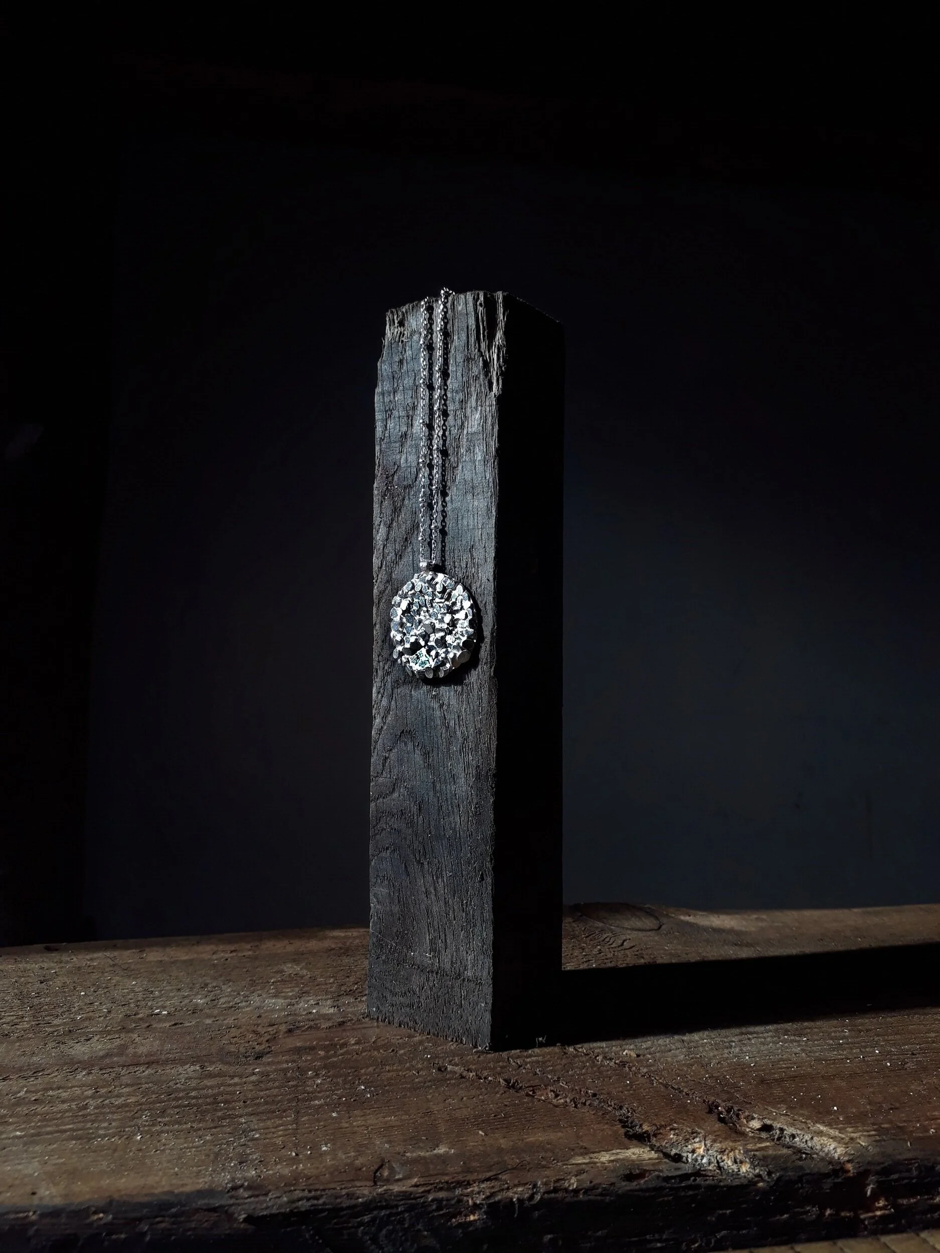 jade+mellor+large+disc+silver+caddis+pendant+black+wood+obelisk.jpg