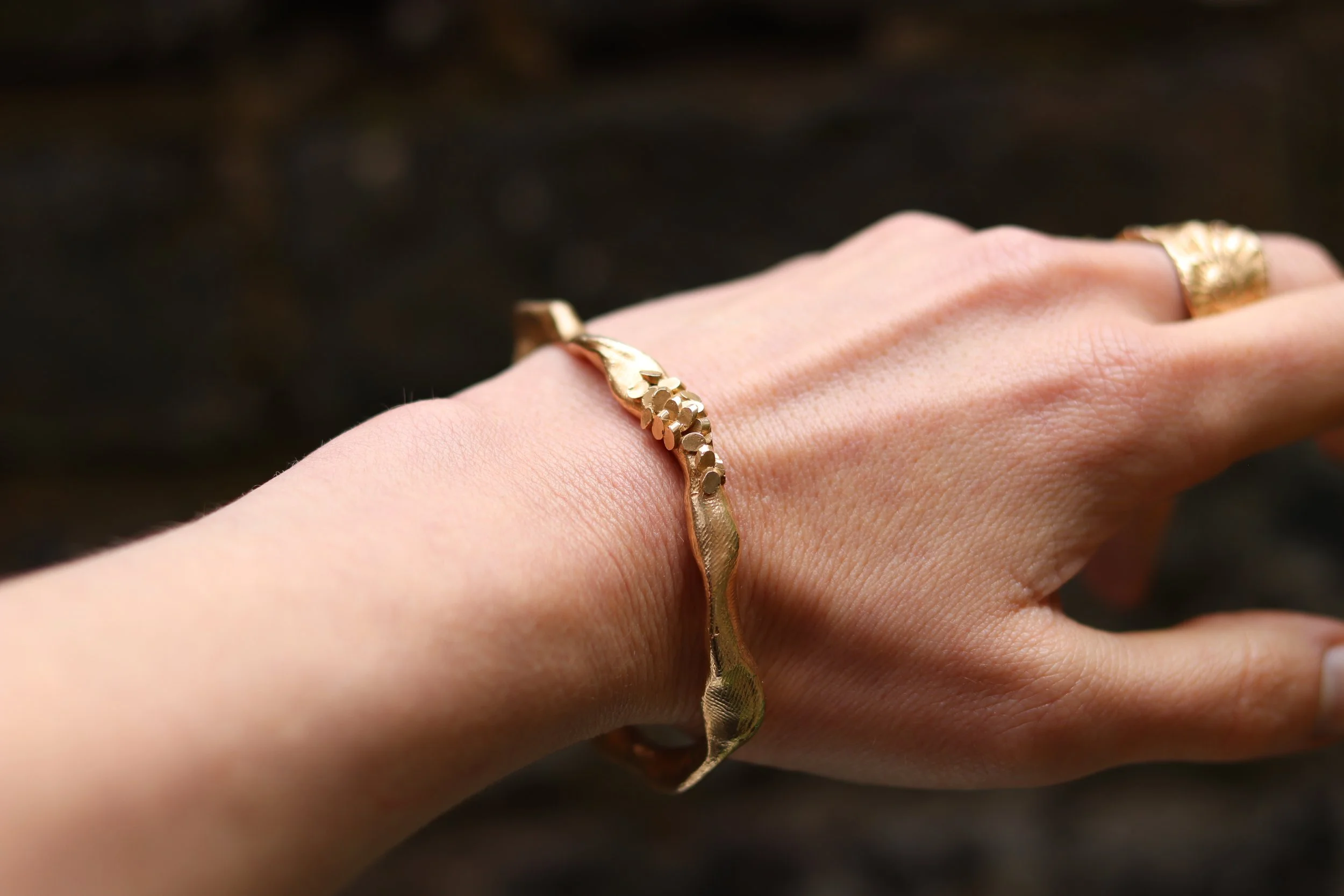 jade mellor caddis detail bangle being worn.JPG