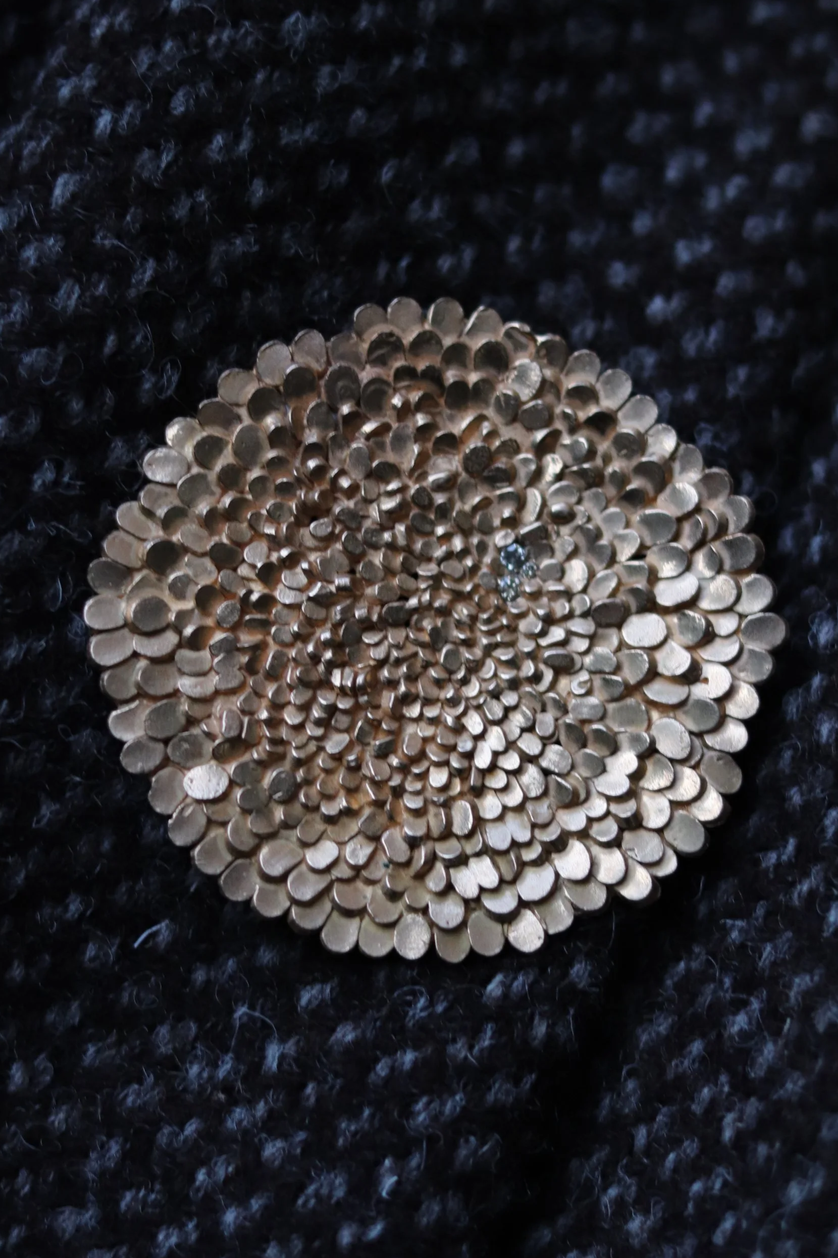 jade+mellor+bronze+brooch+champagne+diamonds+on+dark+pebble+woollen+scarf.png