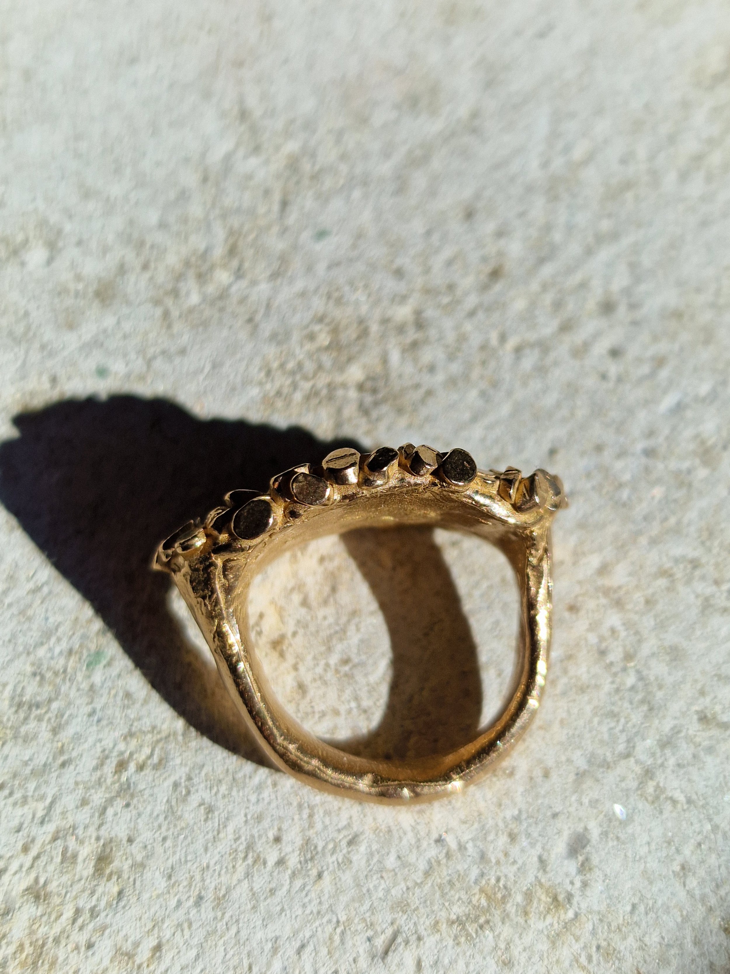 jade mellor east west oval caddis ring above.jpg