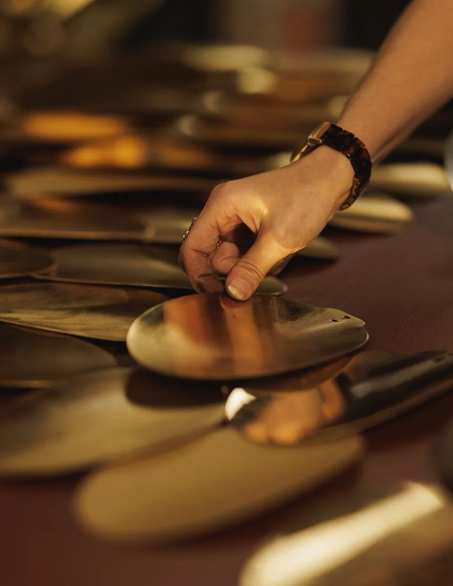 jade mellor placing brass pebbles pangaea atlas web.jpg