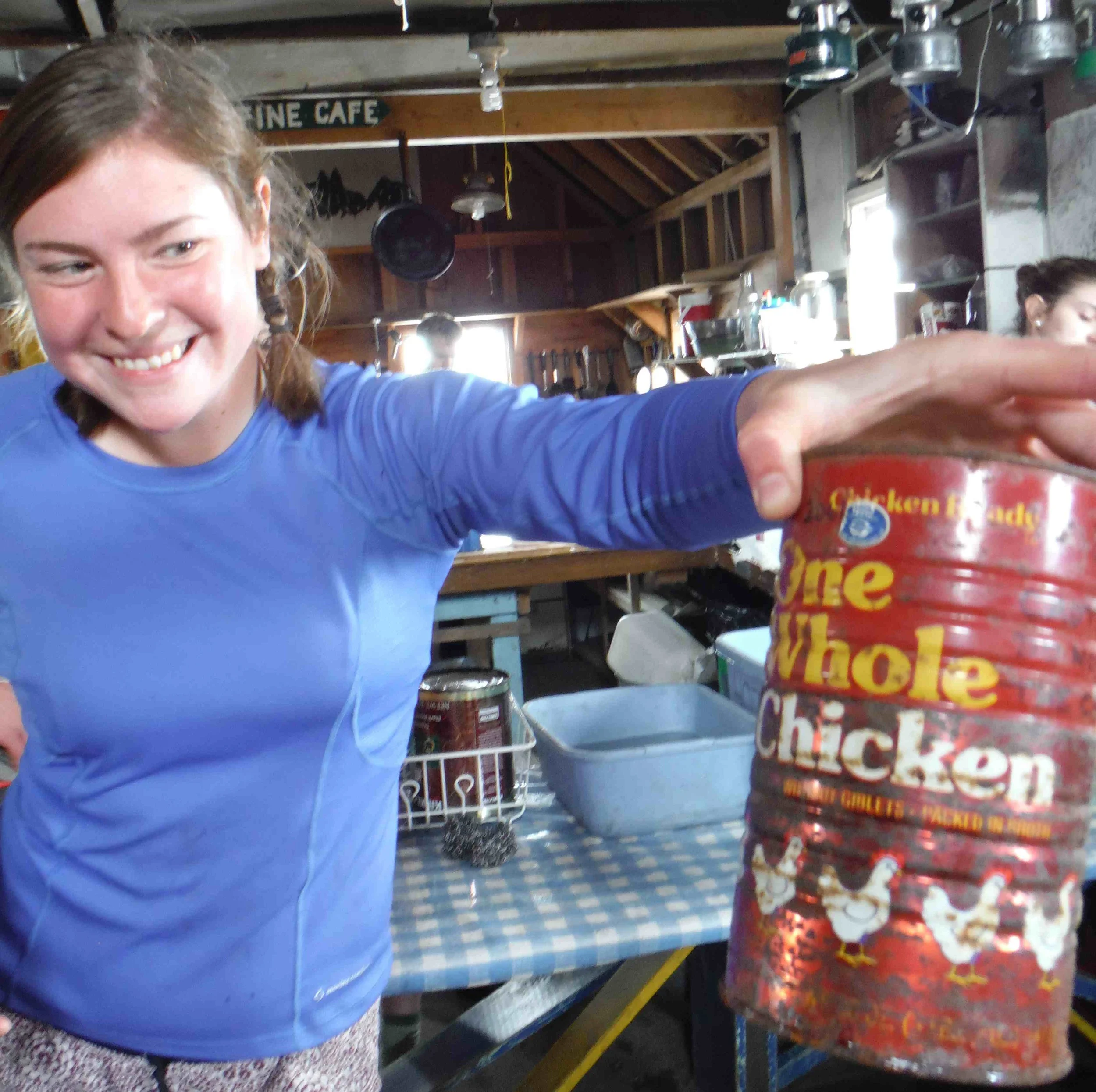 Mary Gianotti in the Camp 17 cook shack with the "Do Not Open Until 2061" funky chicken. Photo: S. Bouckoms
