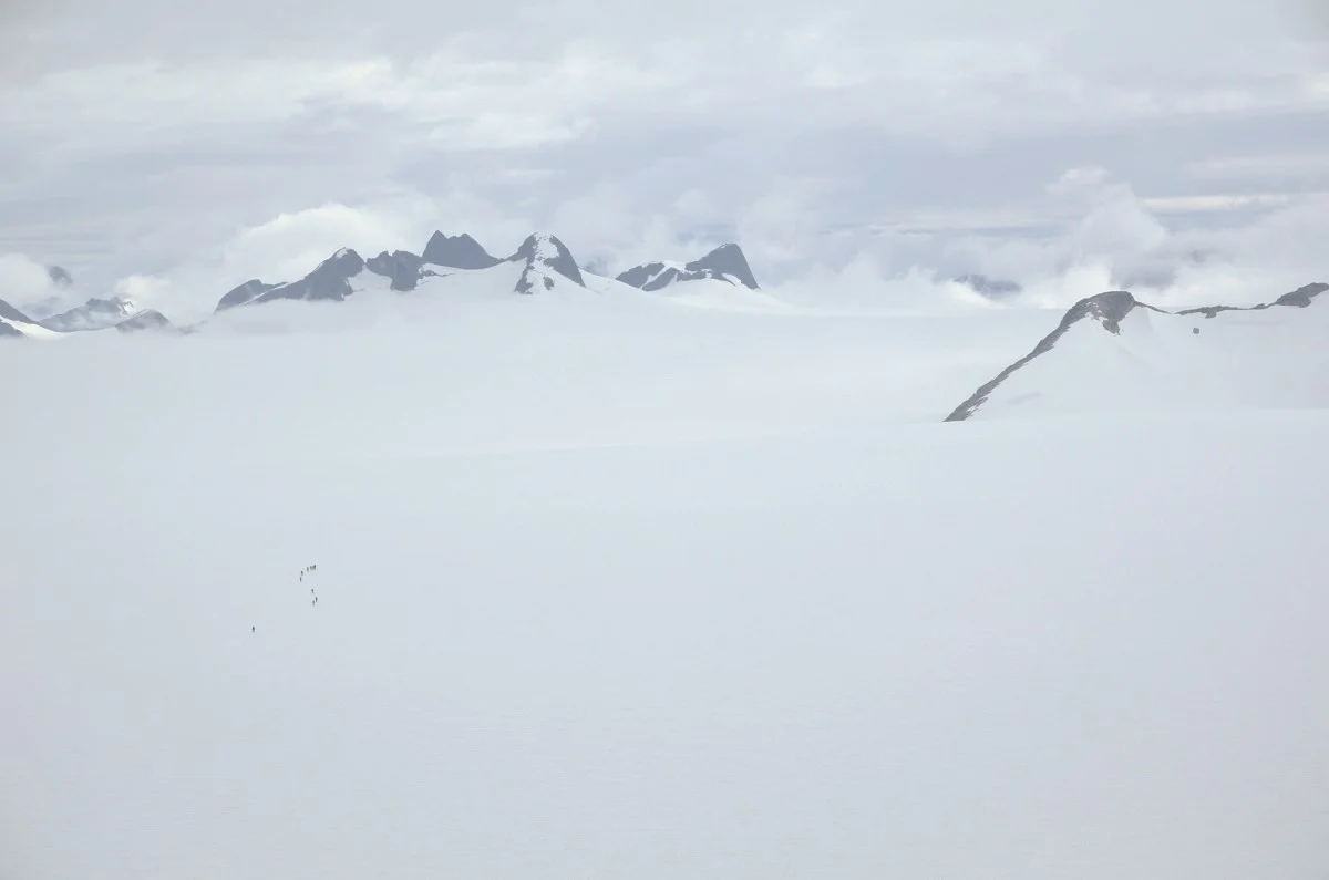 Trail Party One skis across the Taku Glacier – as seen from Camp-10, their destination. Photo by J.L. Kavanaugh