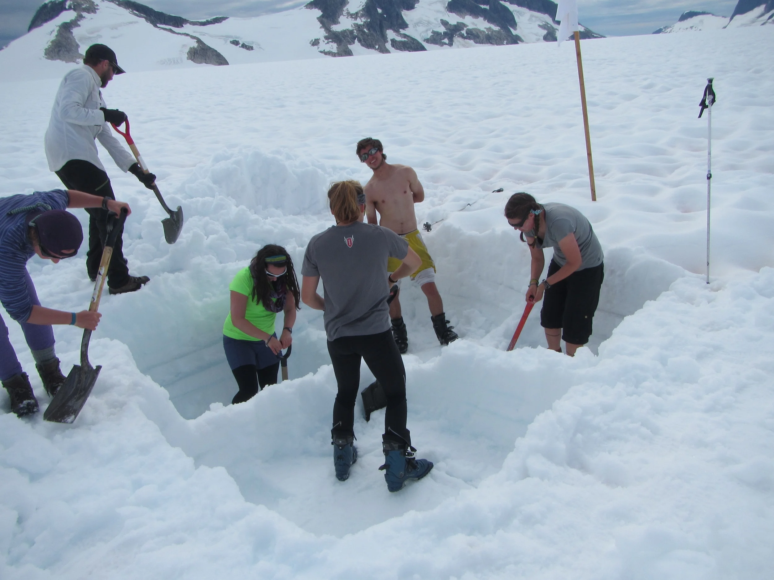 Hannah, Alex, Laurissa, Danielle, Luc, and Carmen dig a mass balance pit on the Southwest branch of the Taku glacier. photo by Gillian Rooker
