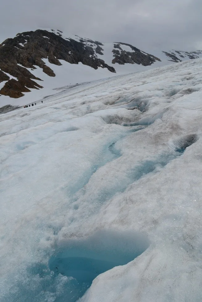 Supraglacial water seen in the ablation zone of the Lemon Creek Glacier. (Photograph by Joel Wilner)