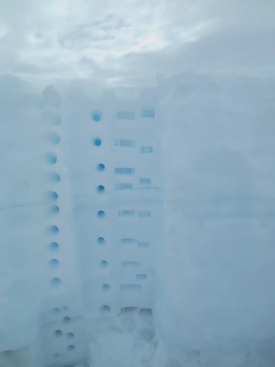  Sampling at various depths in snow pit on the Taku Glacier. (photo credit Jutta Hopkins-LeCheminant)