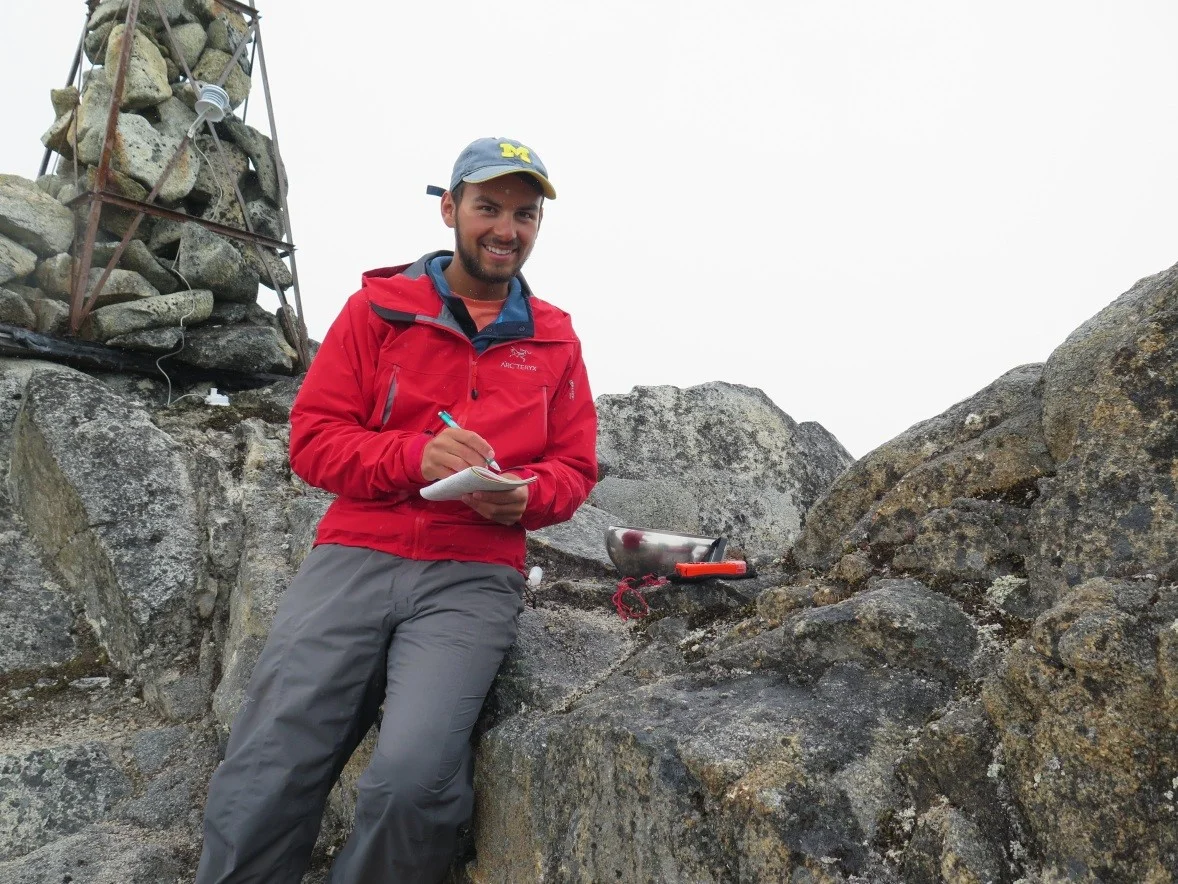 Author collecting rainwater samples at Camp-10. Photo by Blaire Slavin.