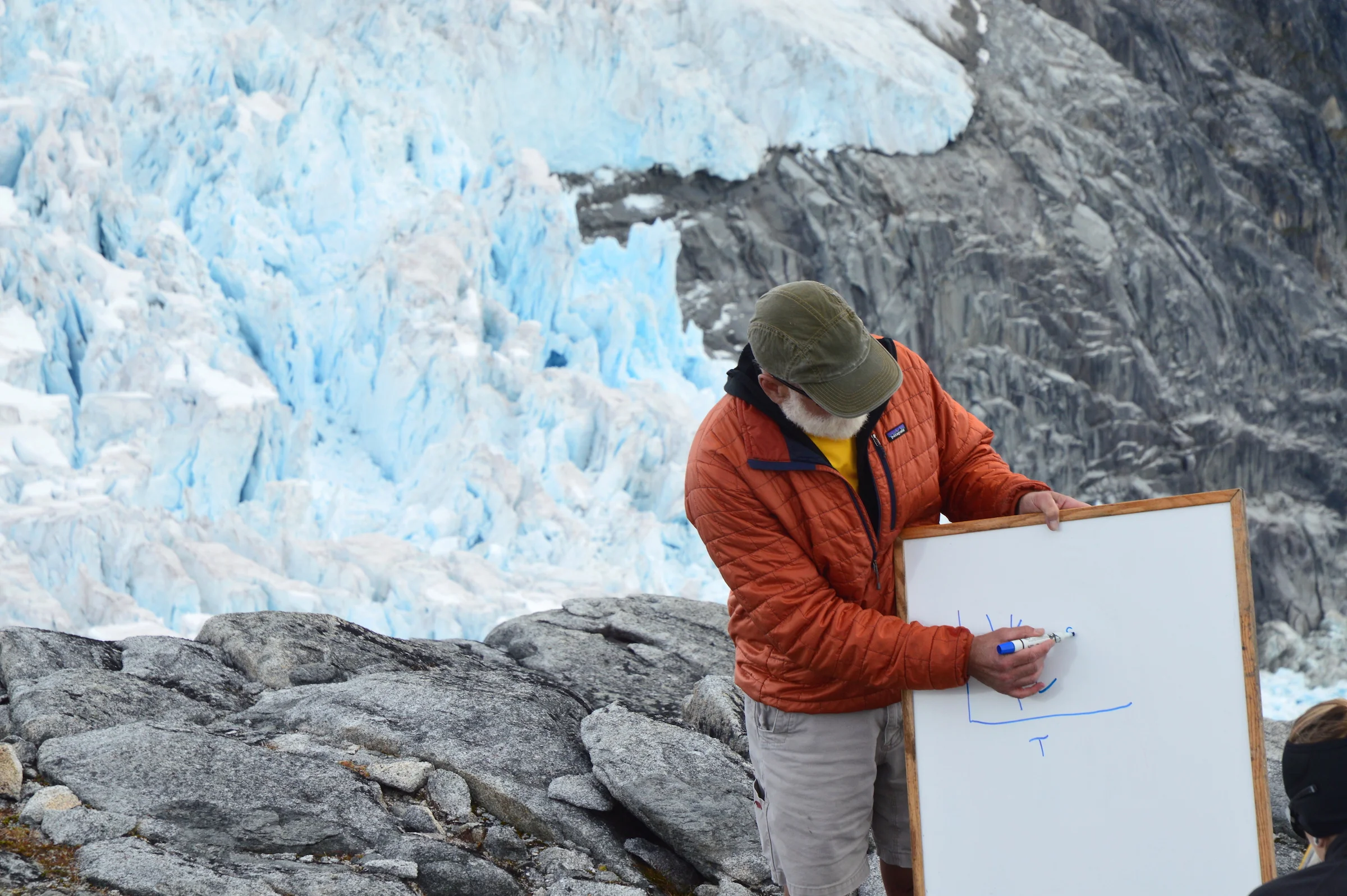 Don Voigt challenging himself to draw the phase diagram of water upside down. Photo by Kristin Timm.