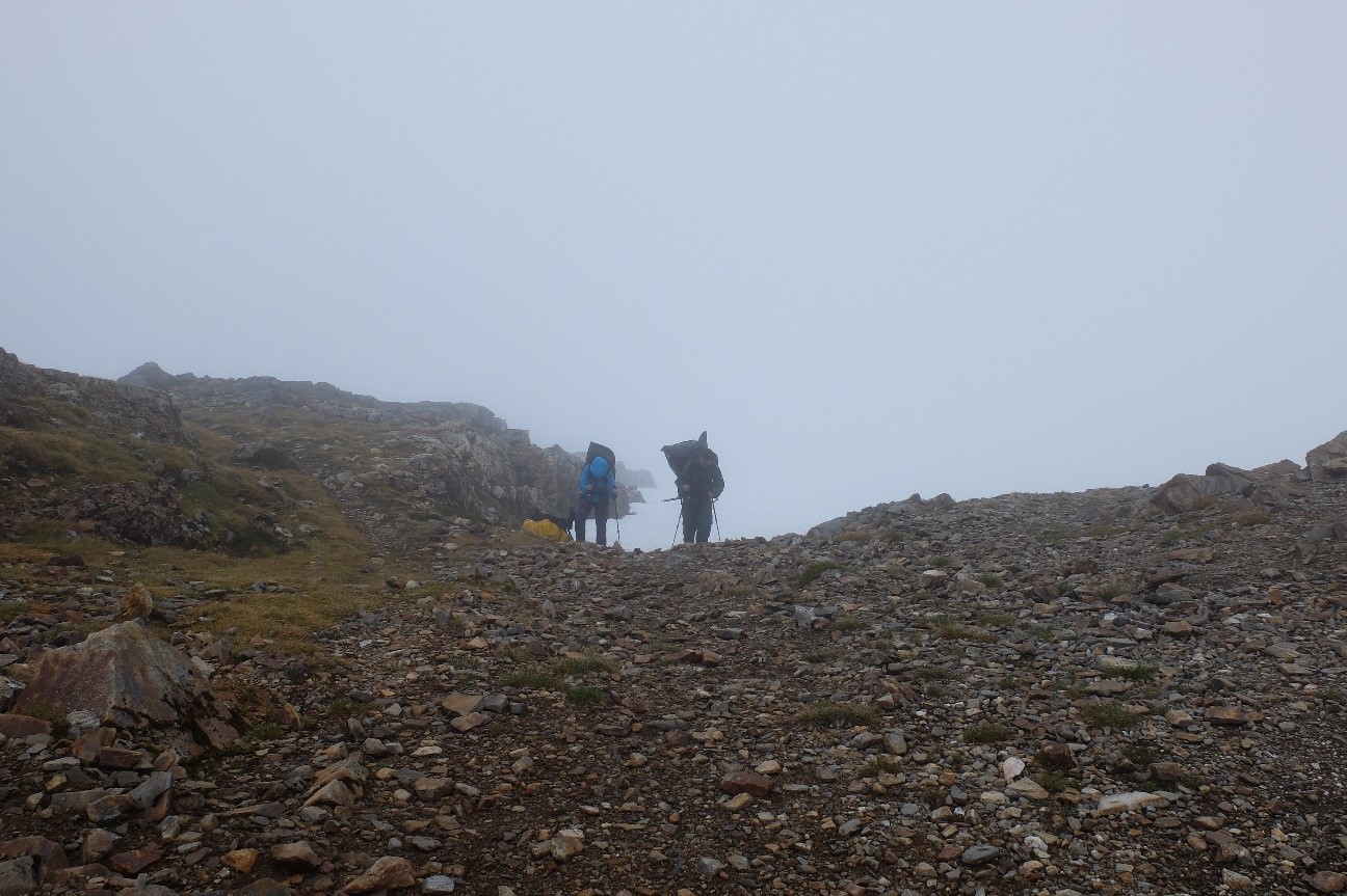 Laurel Rand-Lewis (L) and Jeremy Littell (R) reach the Camp 17 ridge after the storied swamp ascent. All photos by author.