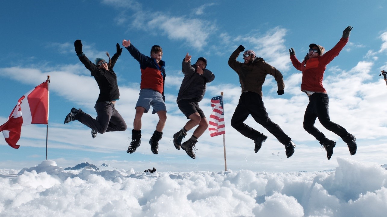 Celebrating the completion of Llewellyn Pit 2 with the American and Canadian flags looking on. From left to right Allie Strel, me (Donovan), Jeff Gunderson, Jacob Hollander, and Tristan Amaral.