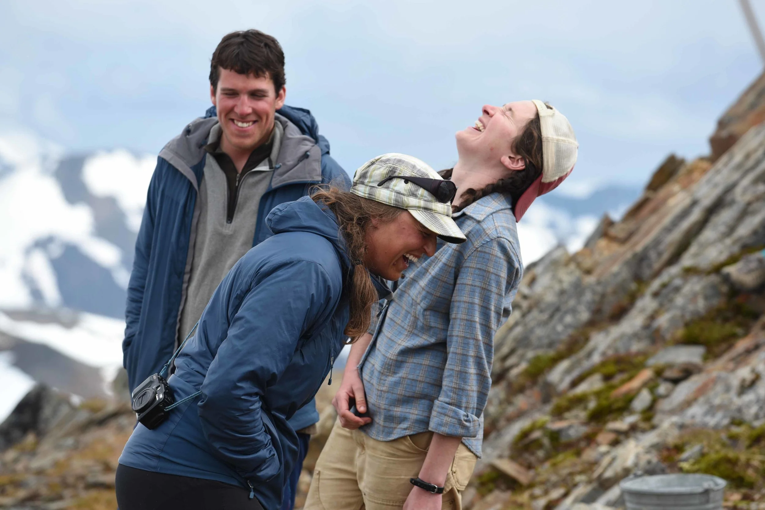 JIRP Field Staff, Matt Pickart, Allie Strel, and Annie Boucher share a laugh at Camp 17. Photo courtesy of PBJ Photography