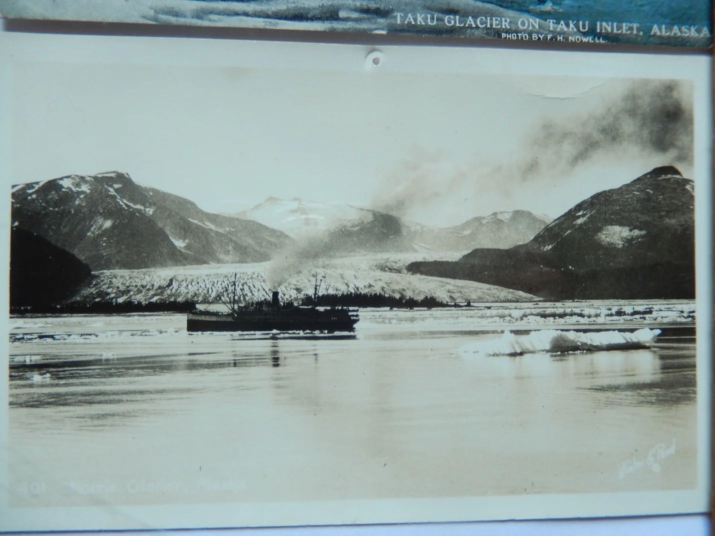 A steamship floats in front of the Taku terminus during an earlier advancement of the glacier.