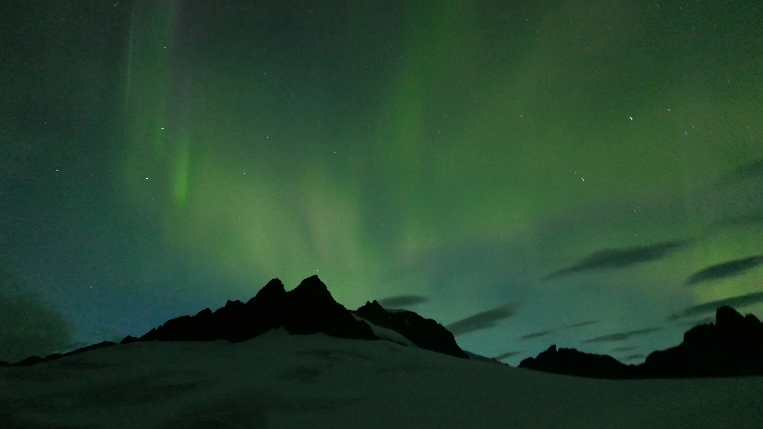 Storm Range at Camp 18 under the Aurora Borealis. Photo Credit: Deirdre Collins