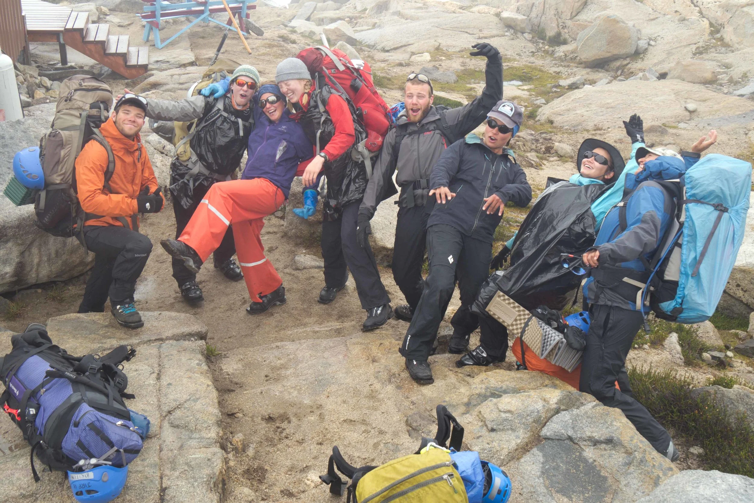 The 2015 mass-balance team readies for their departure from Camp 10 to Camp 9 - in the rain. Note the variety of wet-weather apparel - from full rubber, to Gore Tex, to plastic bags to compensate for a jacket that perhaps isn't as waterproof as desired. Photo: Matt Beedle