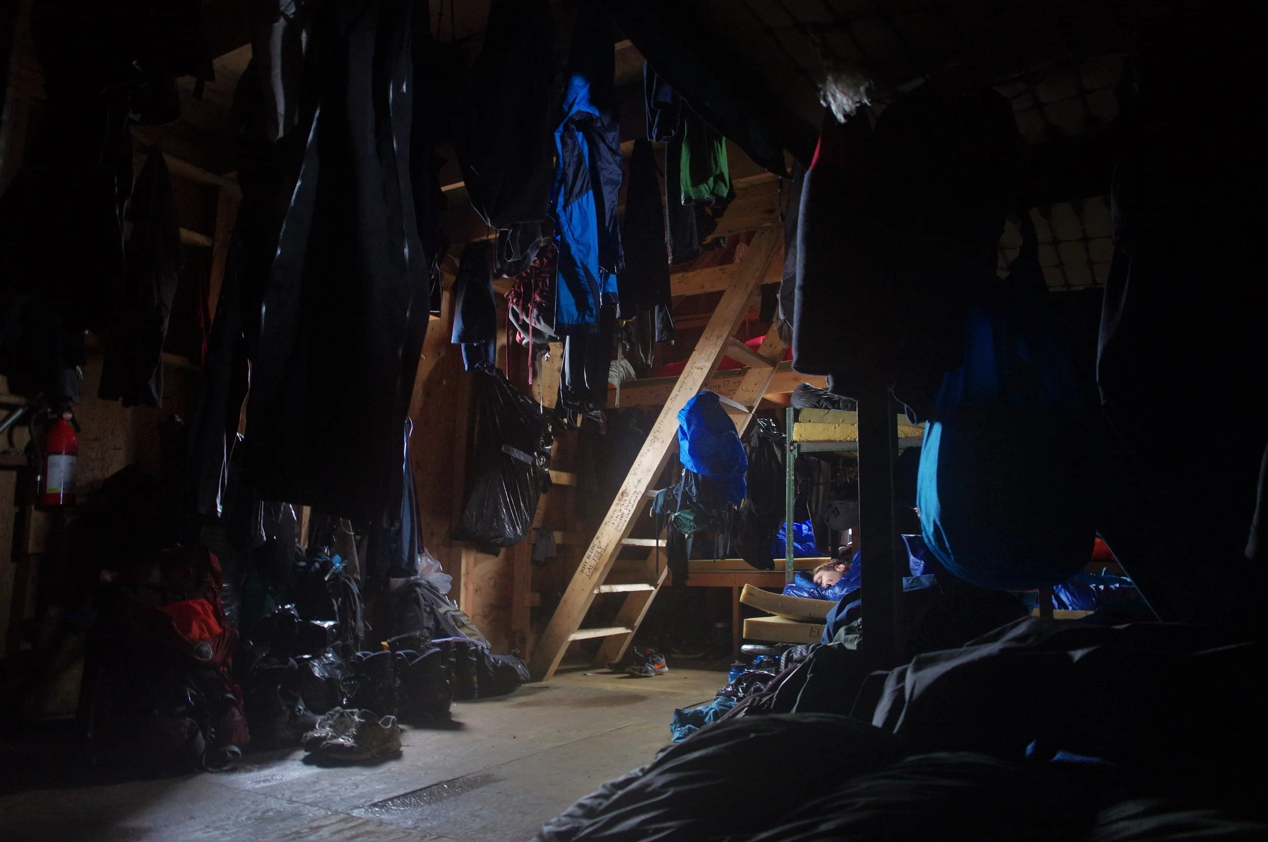 The inside of the Armpit, the domain of the male students. Wet gear hanging from the rafters makes for close quarters. Photo: Daniel Otto.