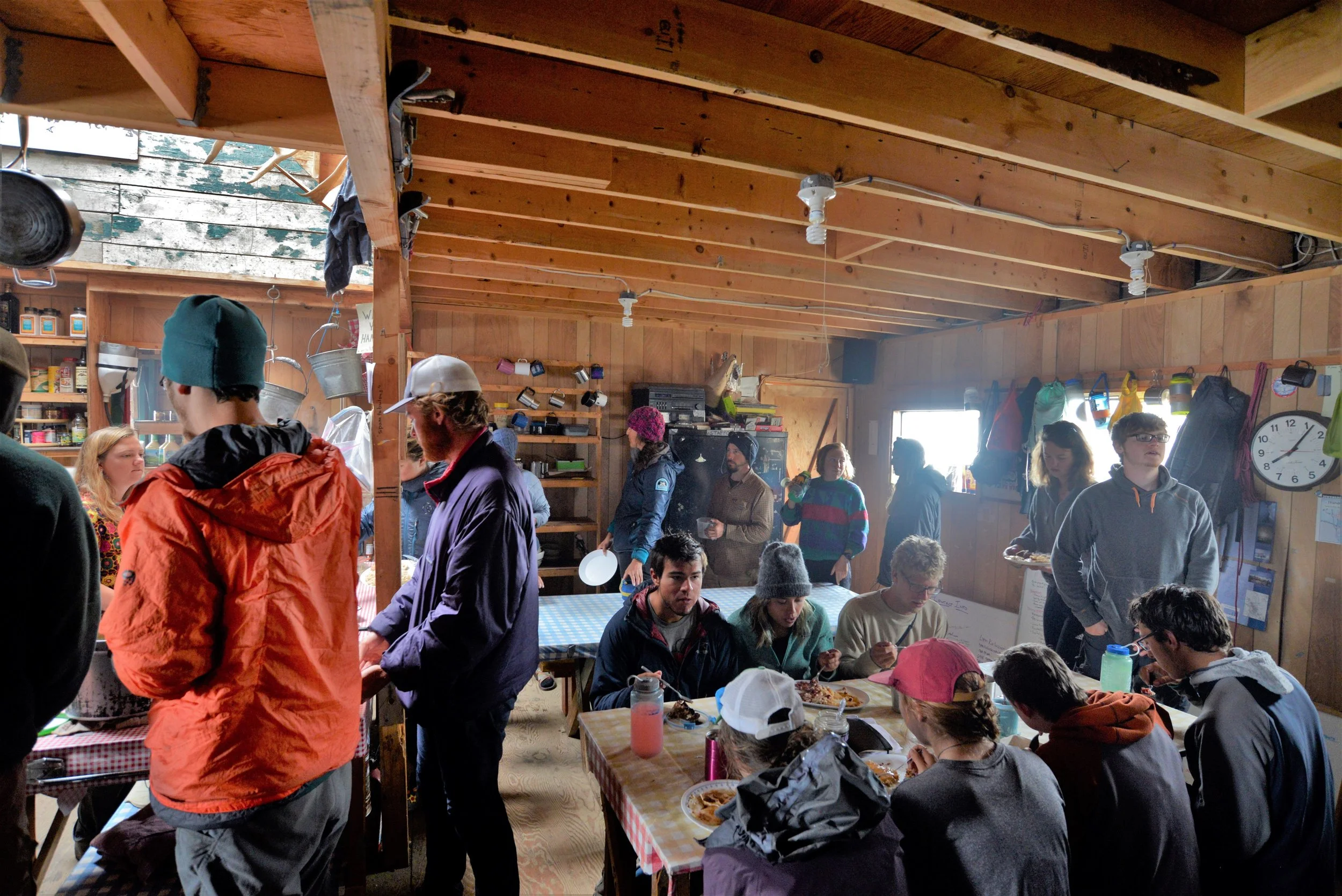 Hungry JIRPers waiting in line for food. With a full camp it takes about 30 minutes for everyone to wind through the breakfast line. The mark of a truly great cook crew is keeping the coffee flowing for the whole process. Photo credit: Jay Ach.