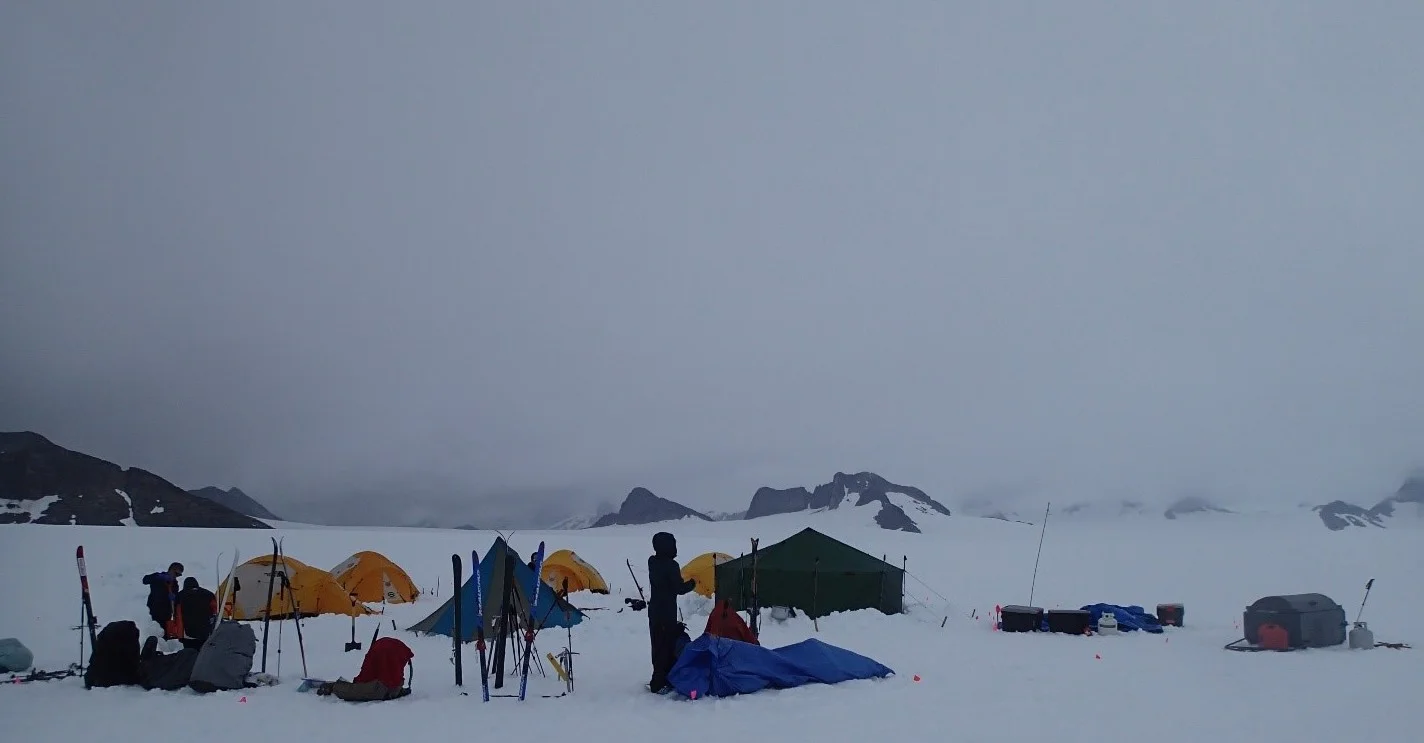 Basecamp for the NW Branch trip, consisting of four sleeping tents, and gear, cook, and dining tents. Photo credit: Julian Cross.